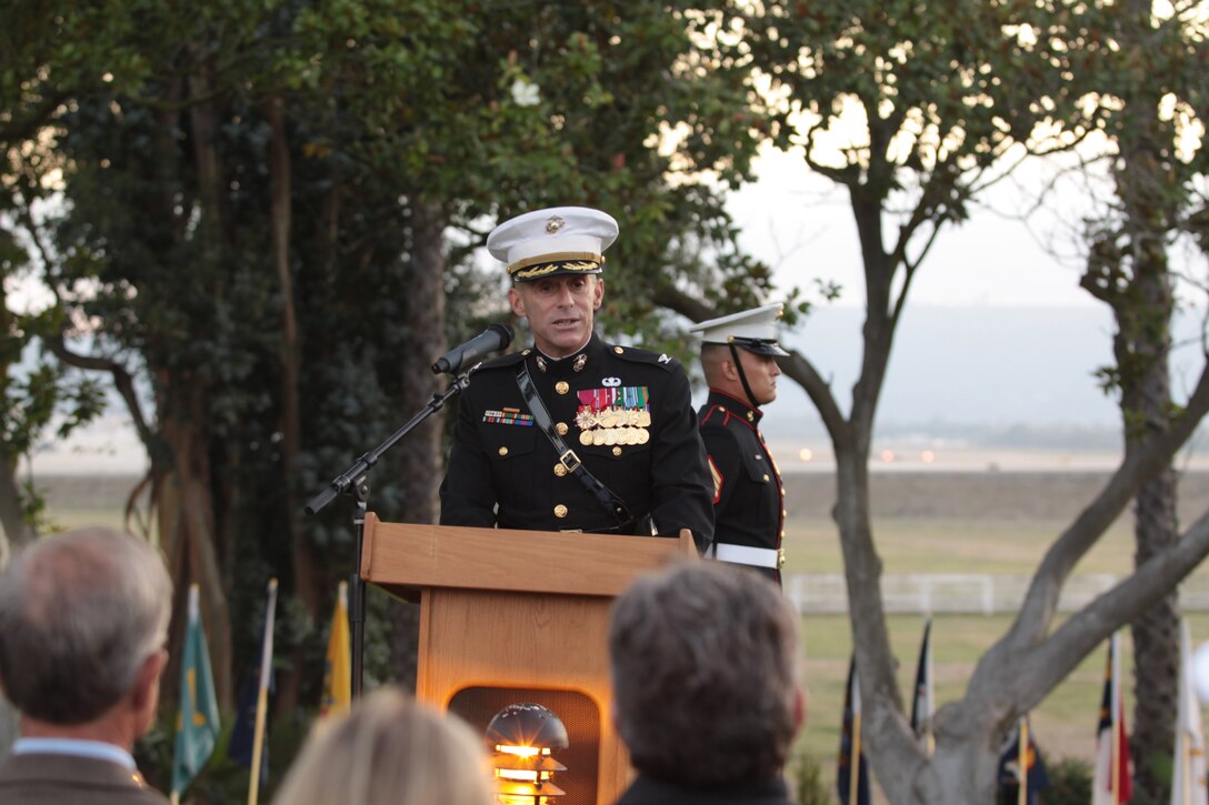 Corporal (now Sgt.) Juan Cerna (left), with daughter Isabella, and wife Rosalinda, as she accepts a letter of appreciation from Col. Dan Ermer, commanding officer, Marine Corps Logistics Base Barstow. Cerna is bidding MCLB farewell and heading for Eglin Air Force Base, Fla.