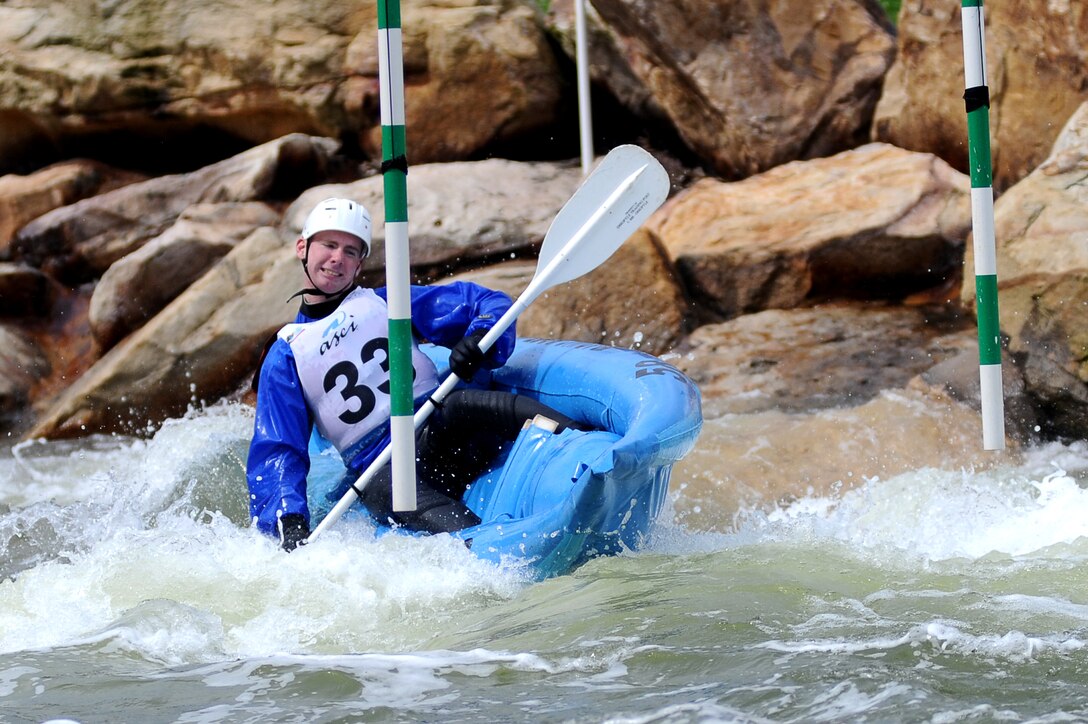 Lance Cpl. James E. Trzcinski, a ceremonial marcher from Company B, leans his kayak as he races through a gate during the Whitewater Wipeout at Deep Creek Lake, Md., Sept. 29, 2011. The Whitewater Wipeout was a kayaking competition in Marine Barracks Washington's 2011 Commander's Cup.