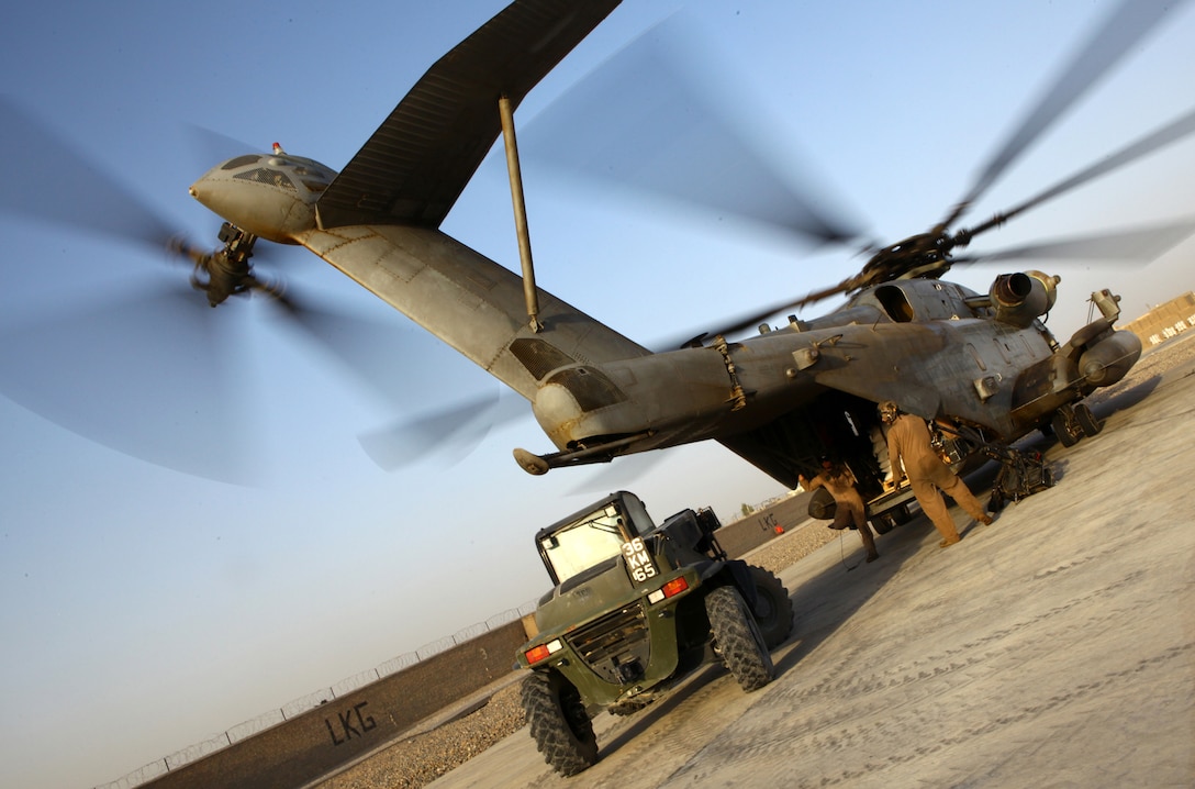 Pallets of wheat and vegetable seed are loaded onto aircraft to be transported from Lashkar Gah, Afghanistan, to Kajaki, Sept. 30, 2011.  Twenty-one metric tons of seed and fertilizer will be distributed to local farmers in Kajaki over the next several weeks as part of a counter-narcotics program in place in Helmand province.  (U.S. Marine Corps photo by Cpl. Katherine M. Solano)