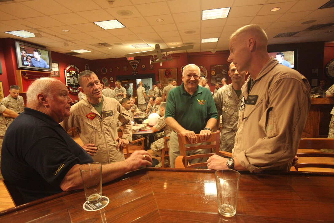 From left to right, retired Maj. Gen. Michael P. Sullivan, Maj. Gen. Jon M. Davis, retired Lt. Col. Bill Egen and Lt. Col. Joe Williams share old war stories and beer in The Pit aboard Marine Corps Air Station Cherry Point, N.C., Sept. 30. The Marine Corps Aviation Association helps bring Marines in contact with their history by bringing retired Marines like Sullivan in to talk about what the Corps was like back in their day.