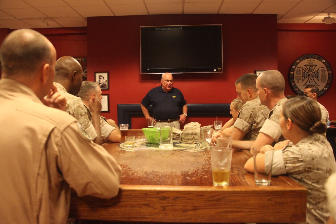 Retired Maj. Gen. Michael "Lancer" Sullivan, former commanding general of the 2nd Marine Aircraft Wing, shares his Marine Corps experiences with senior enlisted and officers at The Pit aboard Marine Corps Air Station Cherry Point, N.C., Sept. 30. Sullivan enlisted in the Marine Corps but then became an officer after becoming dissatisfied as a mechanic. He was commissioned as a pilot in 1956 and retired in 1992, flying 8,700 hours including two combat tours in Vietnam. He is proud of the fact that he has just as many landings as he does take-offs.