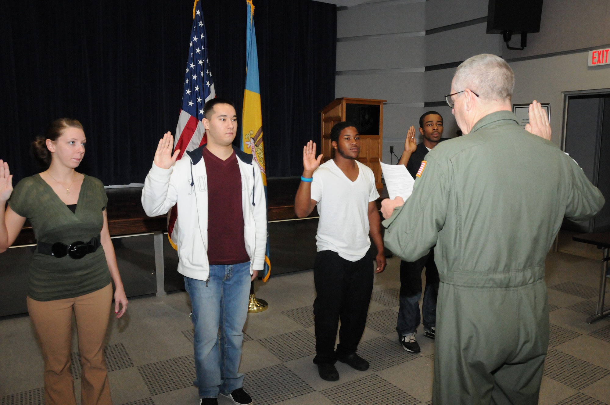 Four new recruits are sworn into the Delaware Air National Guard on Sept. 30, 2011 by 166th Airlift Wing Commander Col. Jonathan Groff inside the unit headquarters in New Castle, Del. Left to Right: Melinda Watson of Newark, Del., John Mason of Pemberton, N.J. (entering vehicle maintenance career field), Wayne Kersey of Dover, Del. (entering the medical field), and Derrick Durroh of Wilm., Del. (entering the aerospace ground equipment career field in maintenance). Each new enlistee will complete Air Force Basic Training in San Antonio, Texas, to be followed by attendance at an Air Force technical school to gain specific career field skills. Wayne Kersey of Dover, Del. is the 400th career recruit enlisted by recruiting supervisor Master Sgt. Gerald Miller, making Sgt. Miller one of the top recruiters in the 65-year history of the unit. The Delaware ANG has 1,100 positions, and is currently hiring for over 15 career fields with several dozen openings within those fields. For information on part-time Air Guard service or available careers, go to www.166aw.ang.af.mil, or www.facebook.com/166thAirliftWing, or call the Delaware ANG recruiting office at 800-742-6713, or 302-323-3444. (U.S. Air Force photo/Tech. Sgt. Harold Herglotz)