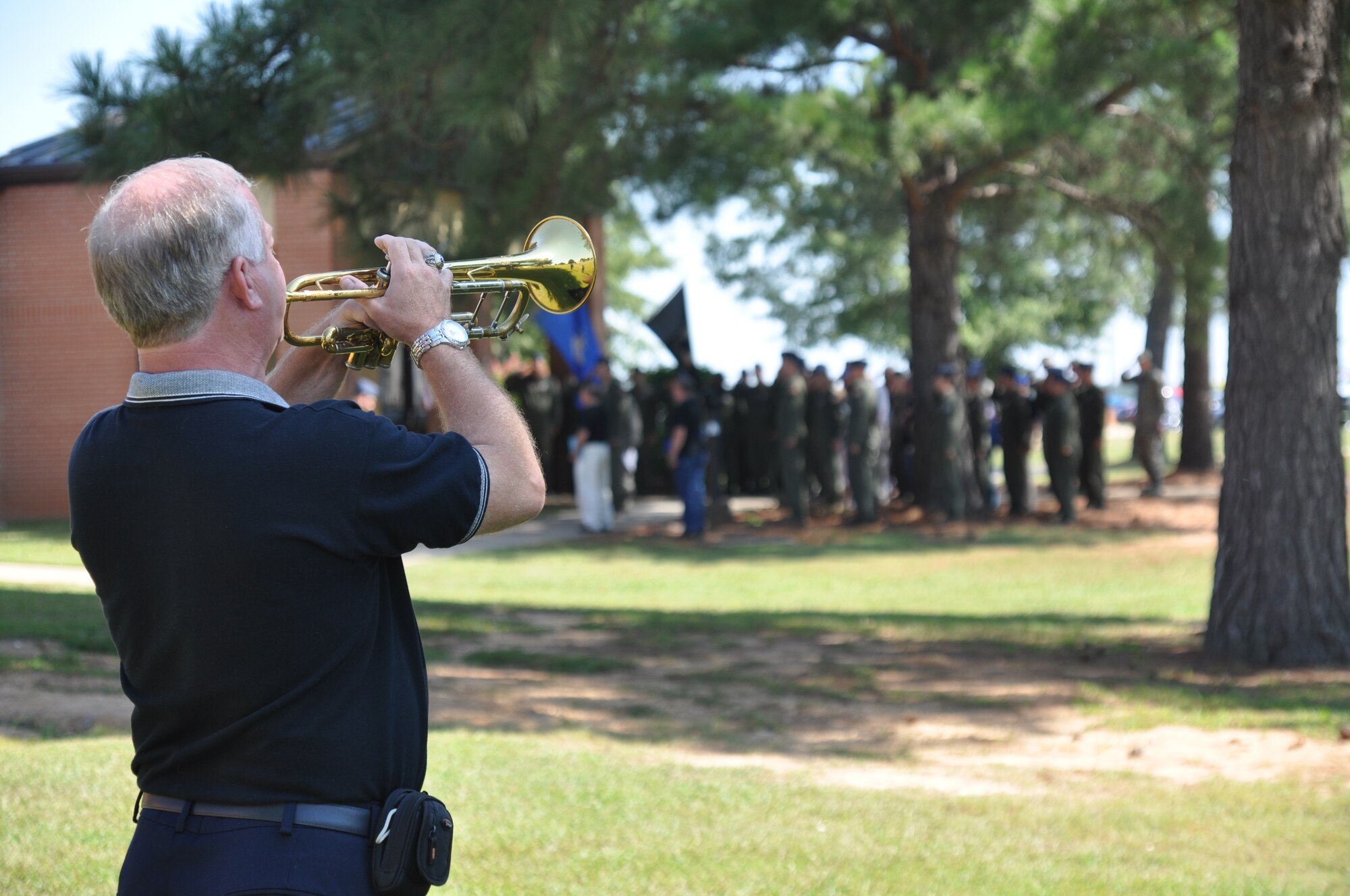 John Boudreaux, Graduate of Columbus UPT Class 74-04 and T-37 Tweet First Assignment Instructor Pilot, plays taps on Sept. 30 during a remembrance ceremony for the eight members of 48th squadrons who died in 2011. (U.S. Air Force photo/Airman 1st Class Chase Hedrick)