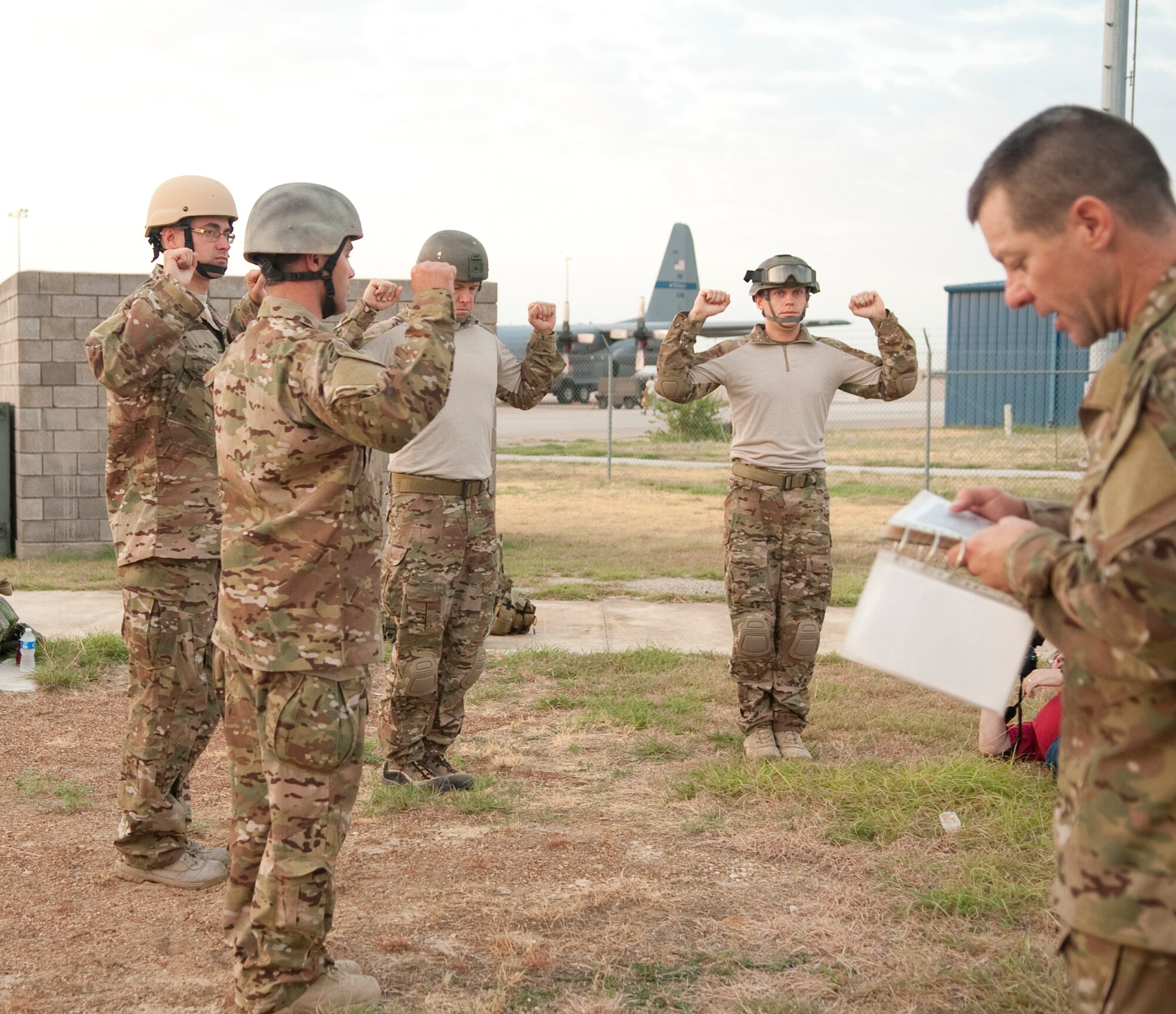 181st Special Operations Weather Team (SOWT), Texas Air National Guard rehearse their checklist prior to jumping out of a C-130 belonging to the 136th Airlift Wing at Naval Air Station Fort Worth, Joint Reserve Base, Texas, Aug. 26, 2011. The SOWT are combat trained meteorologist who are part of special operations. (U.S. air Force photo by Senior Master Sgt. Elizabeth Gilbert)