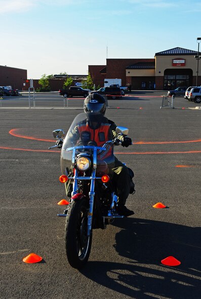 Lt. Col. Robert Davidson, 7th Bomb Wing inspector general, completes a bike safety course, Sept. 30, 2011, at Dyess Air Force Base, Texas.  The course is set up and sponsored by the Green Knights Motorcycle Club to help riders increase motorcycle safety and technique on their personal bikes. (U.S. Air Force photo by Airman 1st Class Peter Thompson/Released)