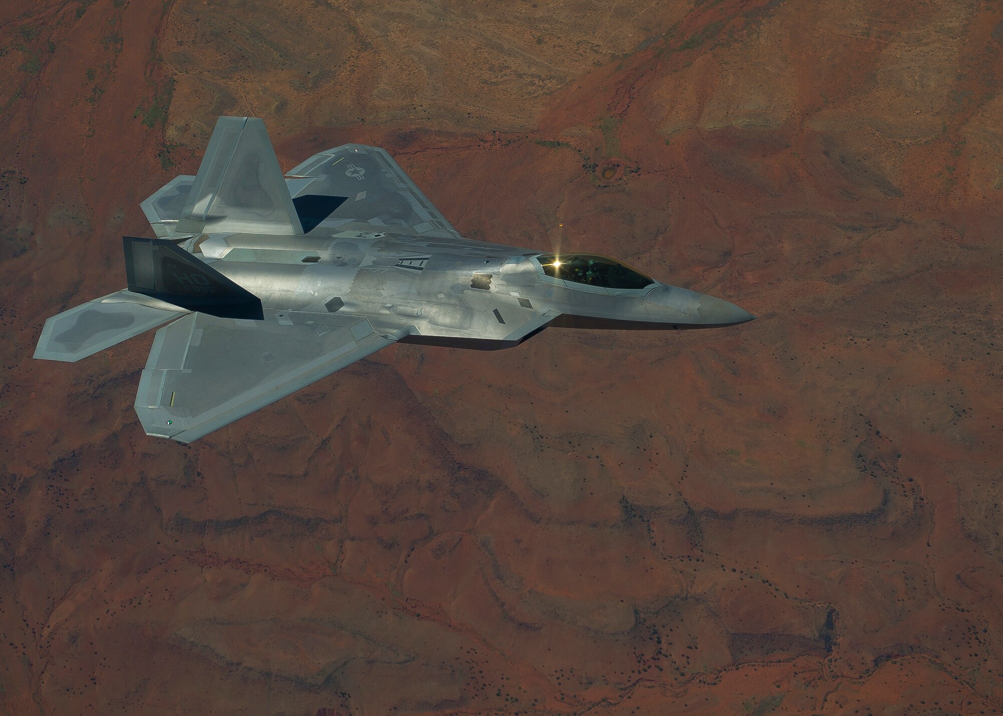 HOLLOMAN AIR FORCE BASE, N.M. -- An F-22 Raptor from the 7th Fighter Squadron flies over the Tularosa Basin during an air to air combat mission Sept. 28, 2011. Two Raptors took flight participating in air to air incursion. (U.S. Air Force photo by Senior Airman John D. Strong II / Released)