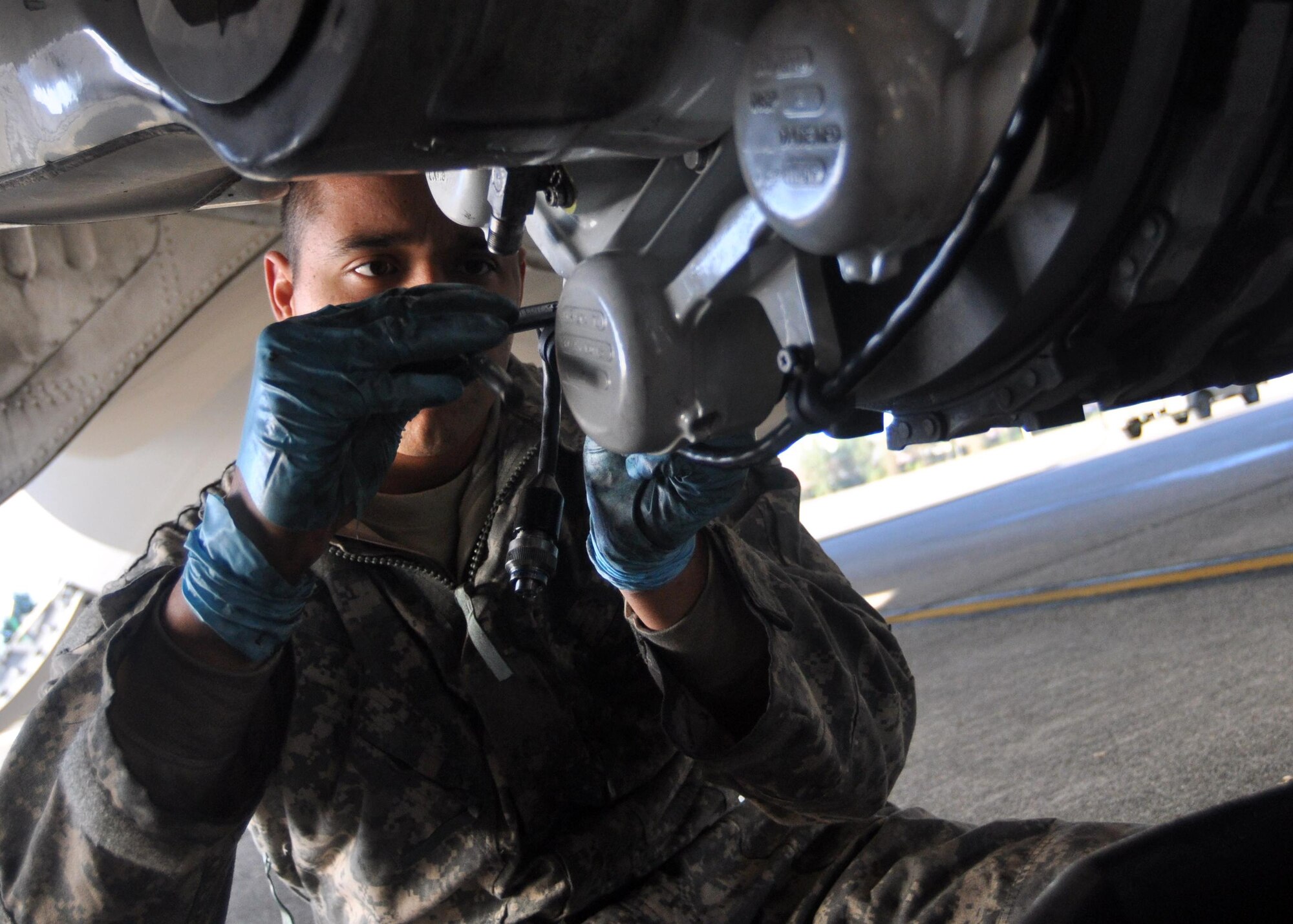 Airman 1st Class Isaac Prieto, 62nd Aircraft Maintenance Squadron crew chief, tightens brakes on a C-17 Globemaster III September 29, 2011, at Joint Base Lewis-McChord, Wash. Routine maintenance is conducted every day on the C-17, which is the newest, most flexible cargo aircraft to enter the airlift force. (U.S. Air Force photo/Airman 1st Class Leah Young)