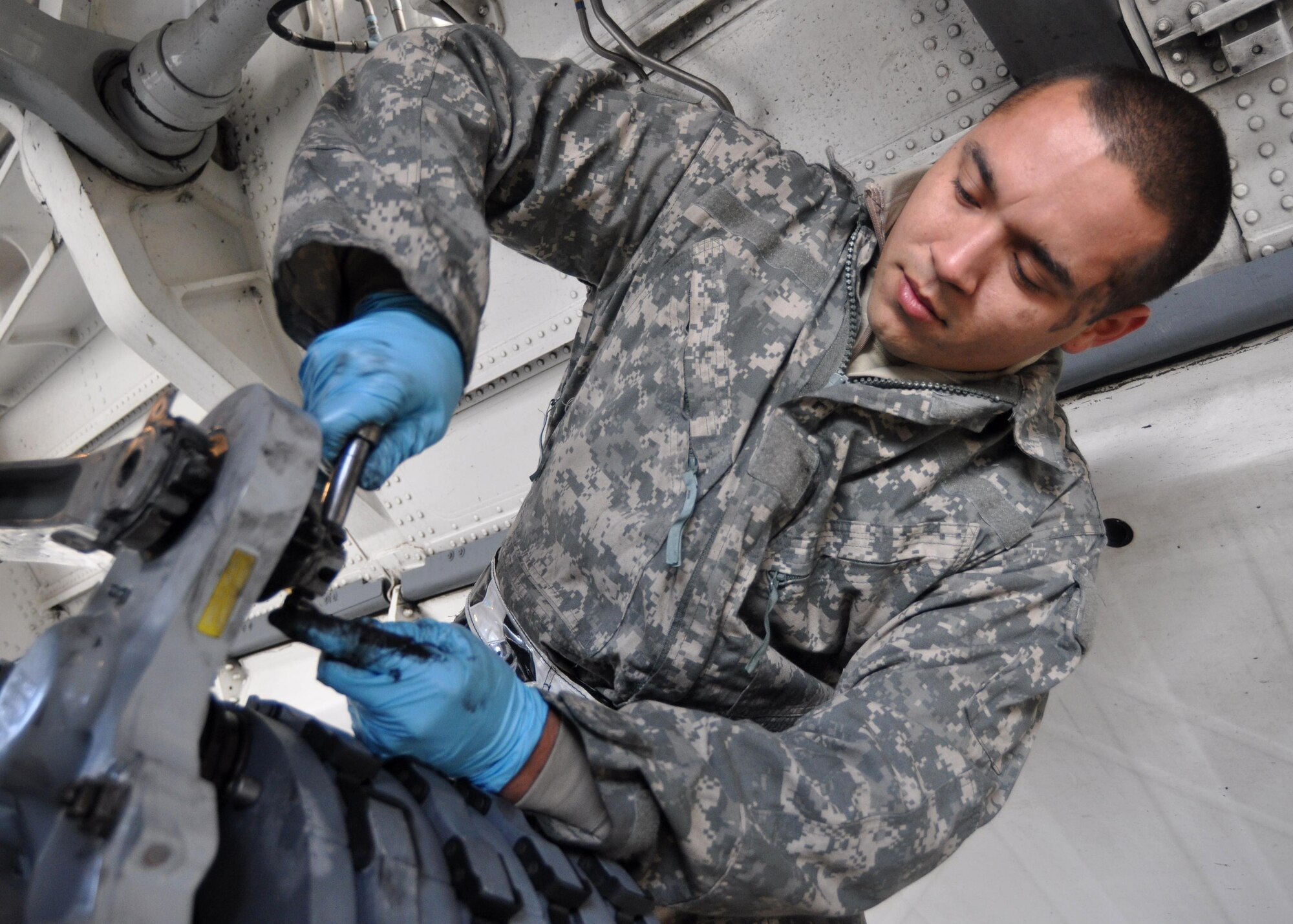 Airman 1st Class Isaac Prieto, 62nd Aircraft Maintenance Squadron crew chief, tightens brakes on a C-17 Globemaster III September 29, 2011, at Joint Base Lewis-McChord, Wash. Performing daily tasks, such as changing brakes, is just one demonstration of Team McChord's effort to provide a fast, flexible and responsive airlift capability. (U.S. Air Force photo/Airman 1st Class Leah Young)