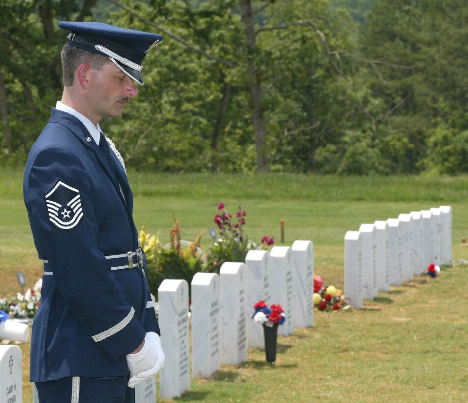 Master Sgt. Bruce See, Honor Guard Superintendant at Dobbins ARB and ceremonial guardsman, bows his head in respect while attending an honor guard ceremony. Sgt. See is retiring after 20 years of service in the United States Air Force.  From 2005 to 2011, Sgt. See held the title of Honor Guard Superintendant. (U.S. Air Force photo/ Don Peek)
