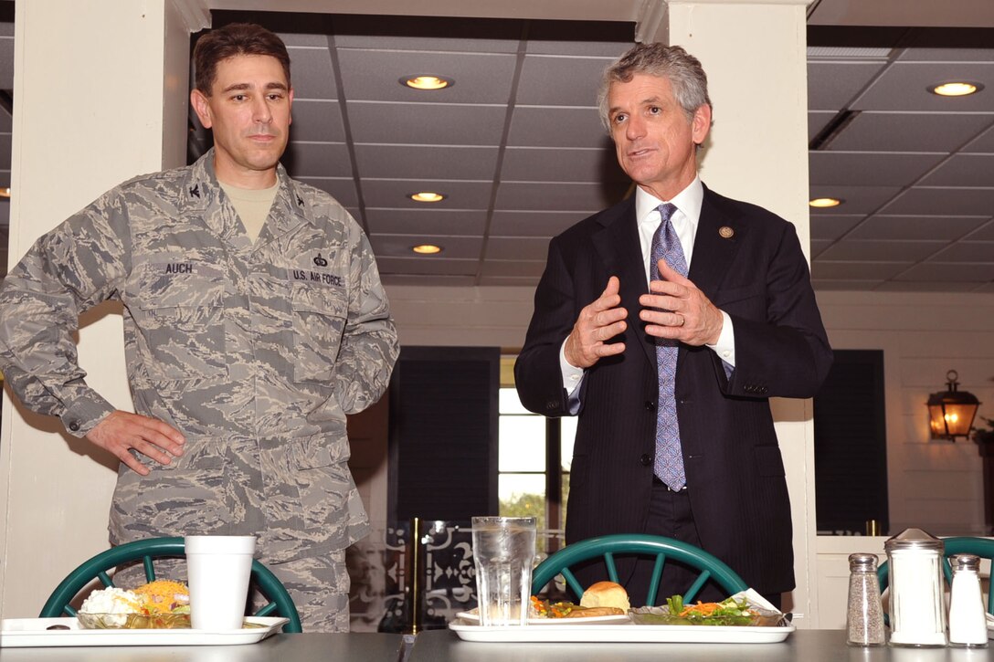 U.S. Air Force Col. Korvin Auch, 633rd Air Base Wing commander, listens while U.S. Rep. Scott Rigell speaks to Airmen at Langely Air Force Base, Va., Sept. 29, 2011.  Rigell served as a U.S. Marine Reservist for six years and is currently serving his first term representing Virginia’s second congressional district.  (U.S. Air Force photo by Staff Sgt. Logan Tuttle/Released)