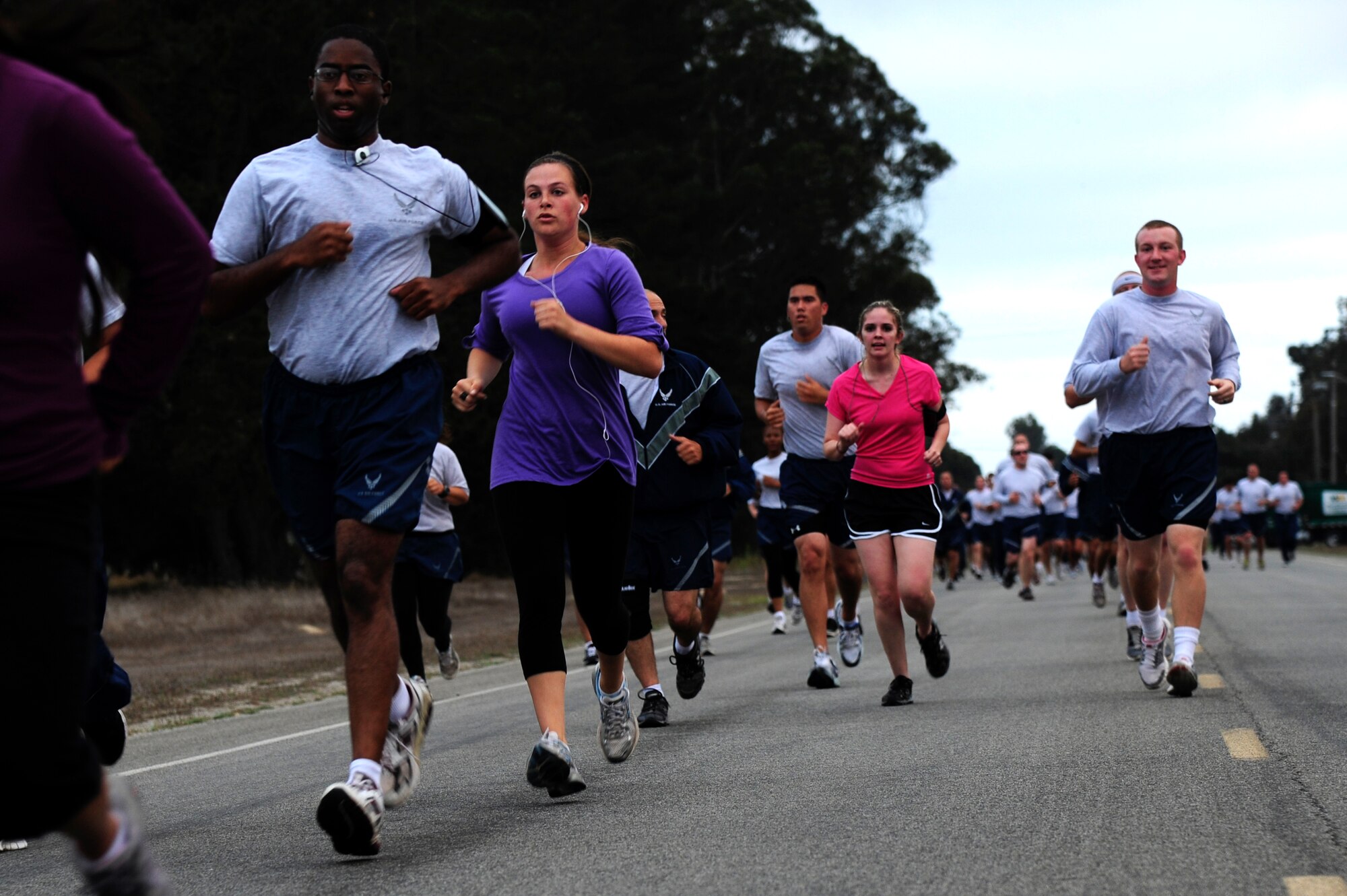 VANDENBERG AIR FORCE BASE, Calif. – In a sea of gray, two members of Team V wear purple and pink shirts in support of Domestic Violence and Breast Cancer Awareness month during this month’s wing run here Friday, Sept. 30, 2011. (U.S. Air Force photo/Senior Airman Lael Huss)