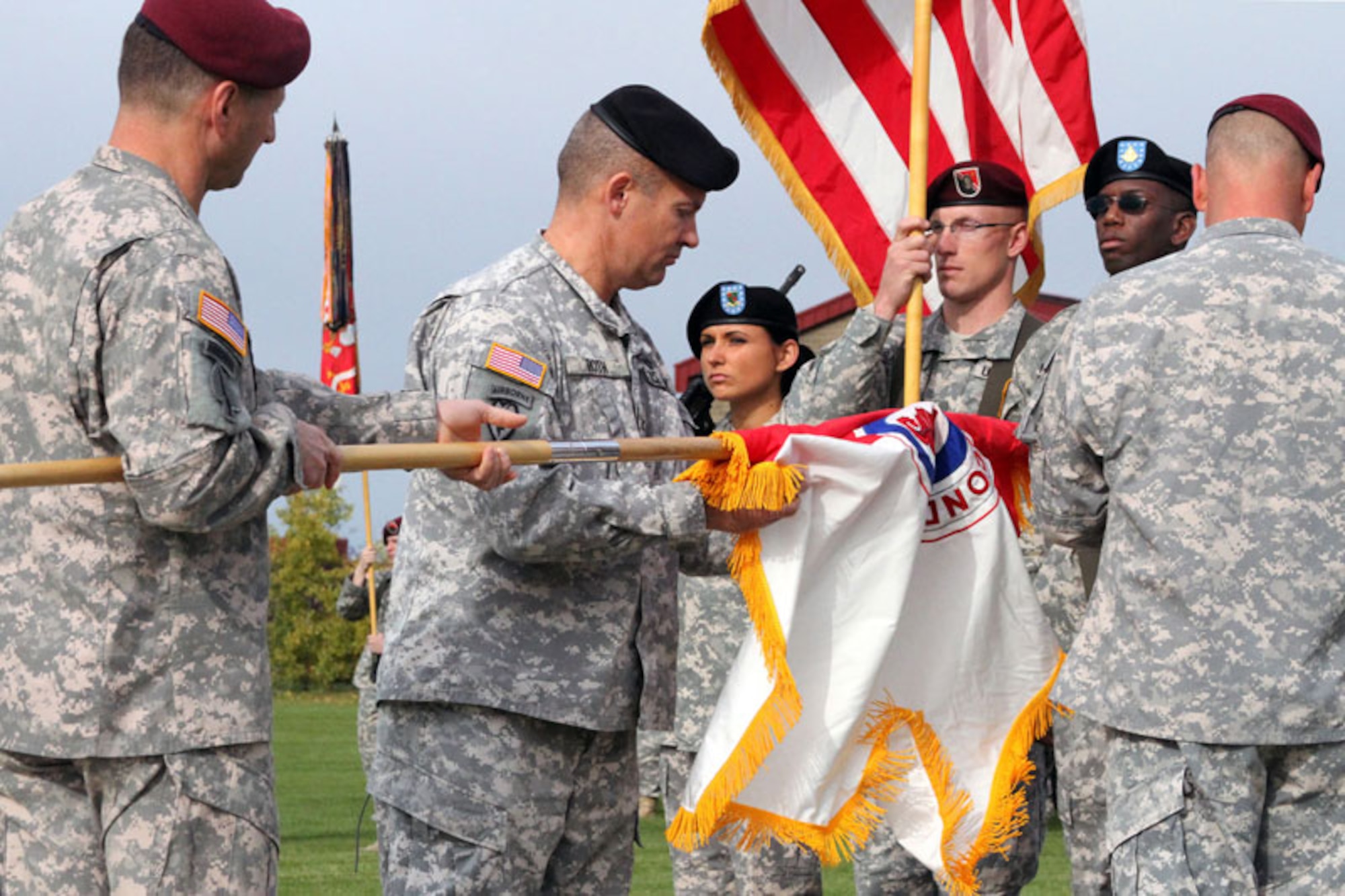 Army Col. Thomas Roth, commander of the 2nd Engineer Brigade, unfurls the newly activated brigade’s colors with help from U.S. Army Alaska Commanding General, Maj. Gen. Raymond Palumbo, Sept. 21, at Joint Base Elmendorf-Richardson. The 3rd Maneuver Enhance Brigade, which activated in fall 2009, was inactivated during the ceremony to make way for the new unit. The 2nd Eng. Bde. will command the same units formally headquartered by 3rd MEB.  (U.S. Army photo/2nd Engineer Brigade Public Affairs Office)