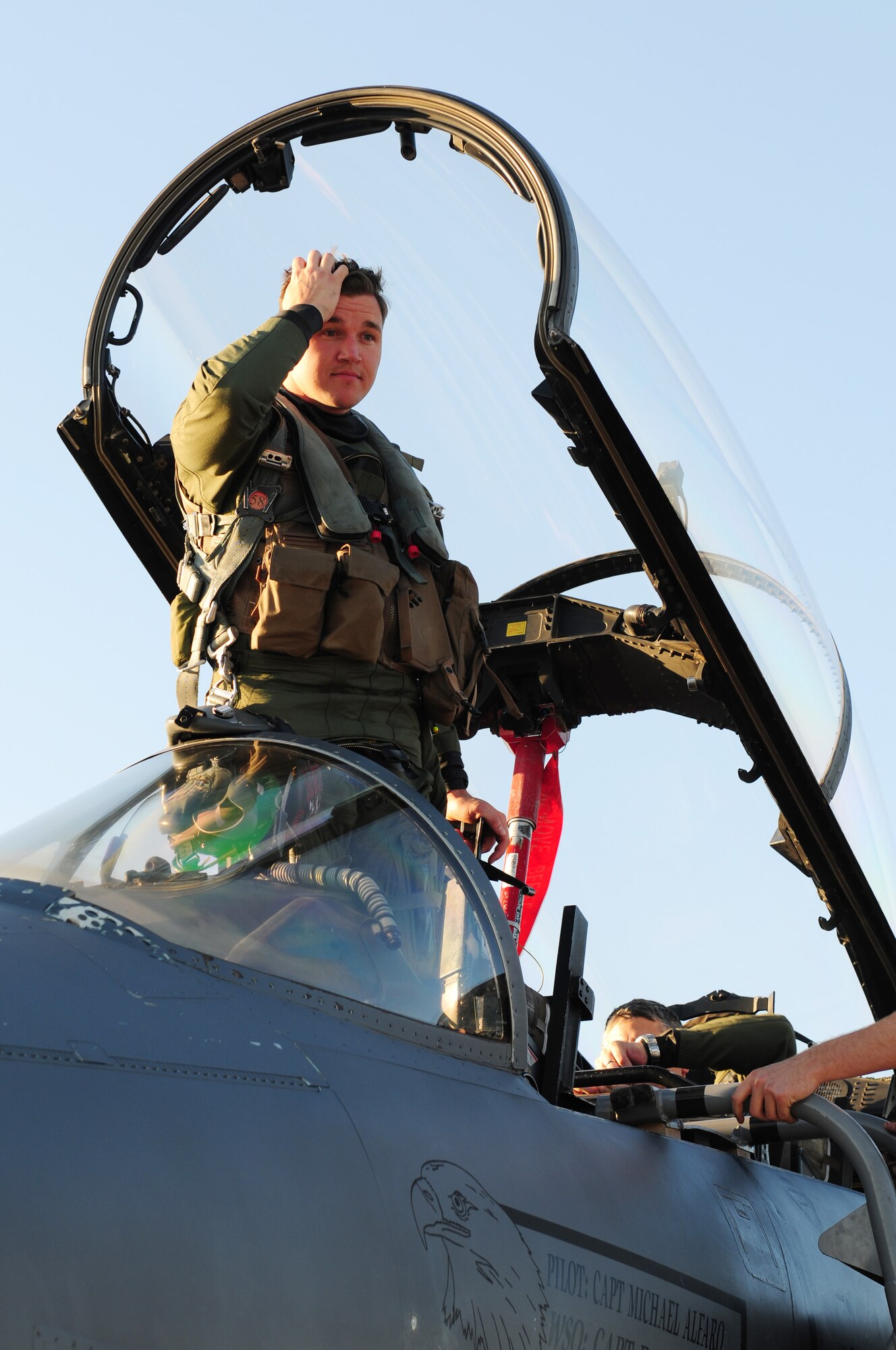 ROYAL AIR FORCE LAKENHEATH, England ? Capt. Christopher Collins, 494th Fighter Squadron pilot, prepares to deplane on Sept. 30, 2011. Airmen from the 494th Fighter Squadron returned from deployment to Kunsan Air Base, South Korea where they supported the 8th FW?s mission. (U.S. Air Force photo by Senior Airman Lausanne Morgan)