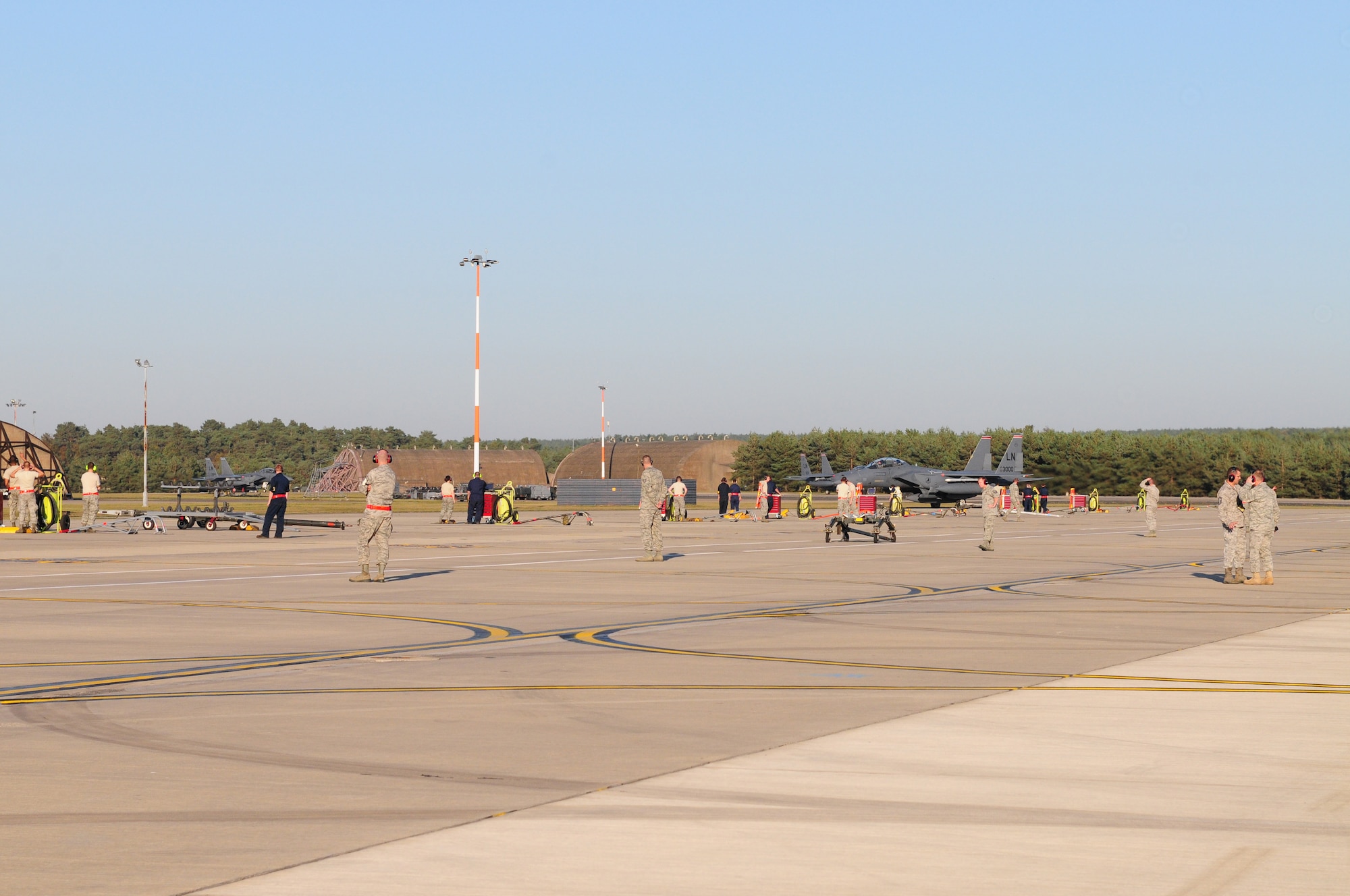 ROYAL AIR FORCE LAKENHEATH, England ? Members of the 48th Fighter Wing and families eagerly await the arrival of deployment returnees on Sept. 30, 2011. Airmen from the 494th Fighter Squadron returned from deployment to Kunsan Air Base, South Korea where they supported the 8th FW?s mission. (U.S. Air Force photo by Senior Airman Lausanne Morgan)