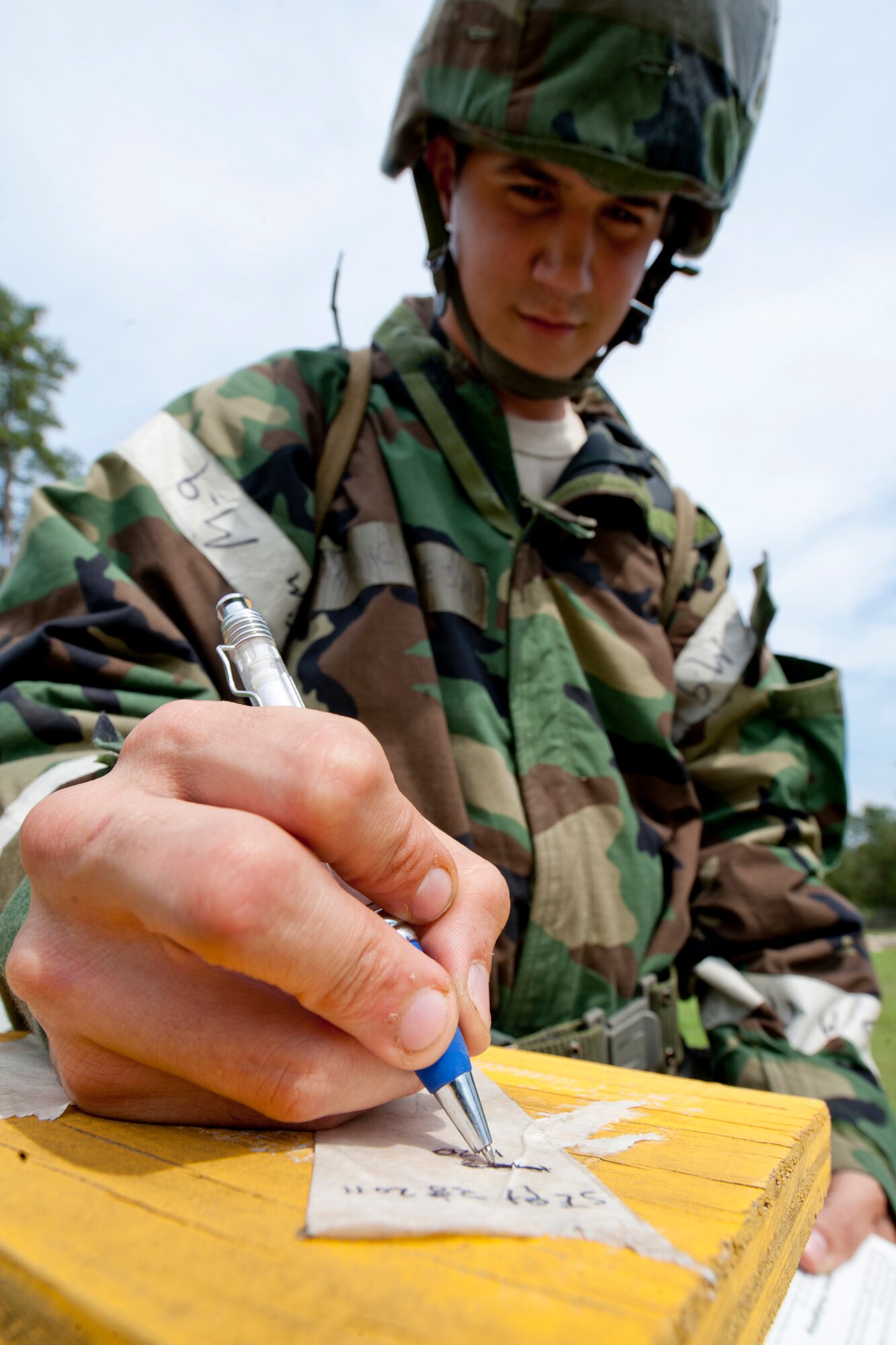 U.S. Air Force Airman 1st Class Nickolas Hoyt, 23rd Civil Engineer Squadron post attack reconnaissance team member, checks a PAR station for possible chemical residue during a phase II operational readiness exercise at Moody Air Force Base, Ga., Sept. 28, 2011. PAR teams are tasked to periodically check each station to ensure the base is clear of contamination. (U.S. Air Force photo by Staff Sgt. Joshua J. Garcia/Released) 