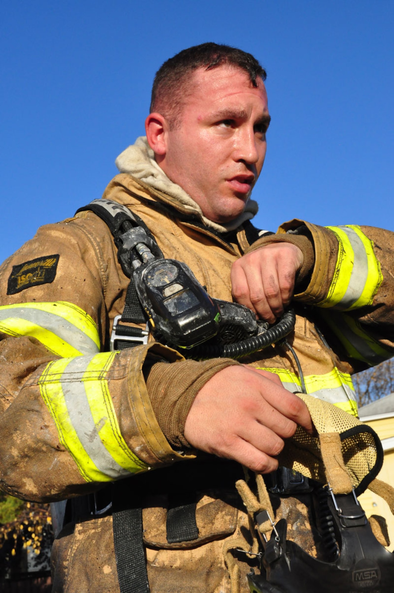 The Joint Base Elmendorf-Richardson Firefighters respond to a fire in base housing, Alaska, Sept. 28, 2011. Twenty-nine firefighters fought the blazes for more than four hours.  (U.S. Air Force photo by Maj. Joseph Coslett)
