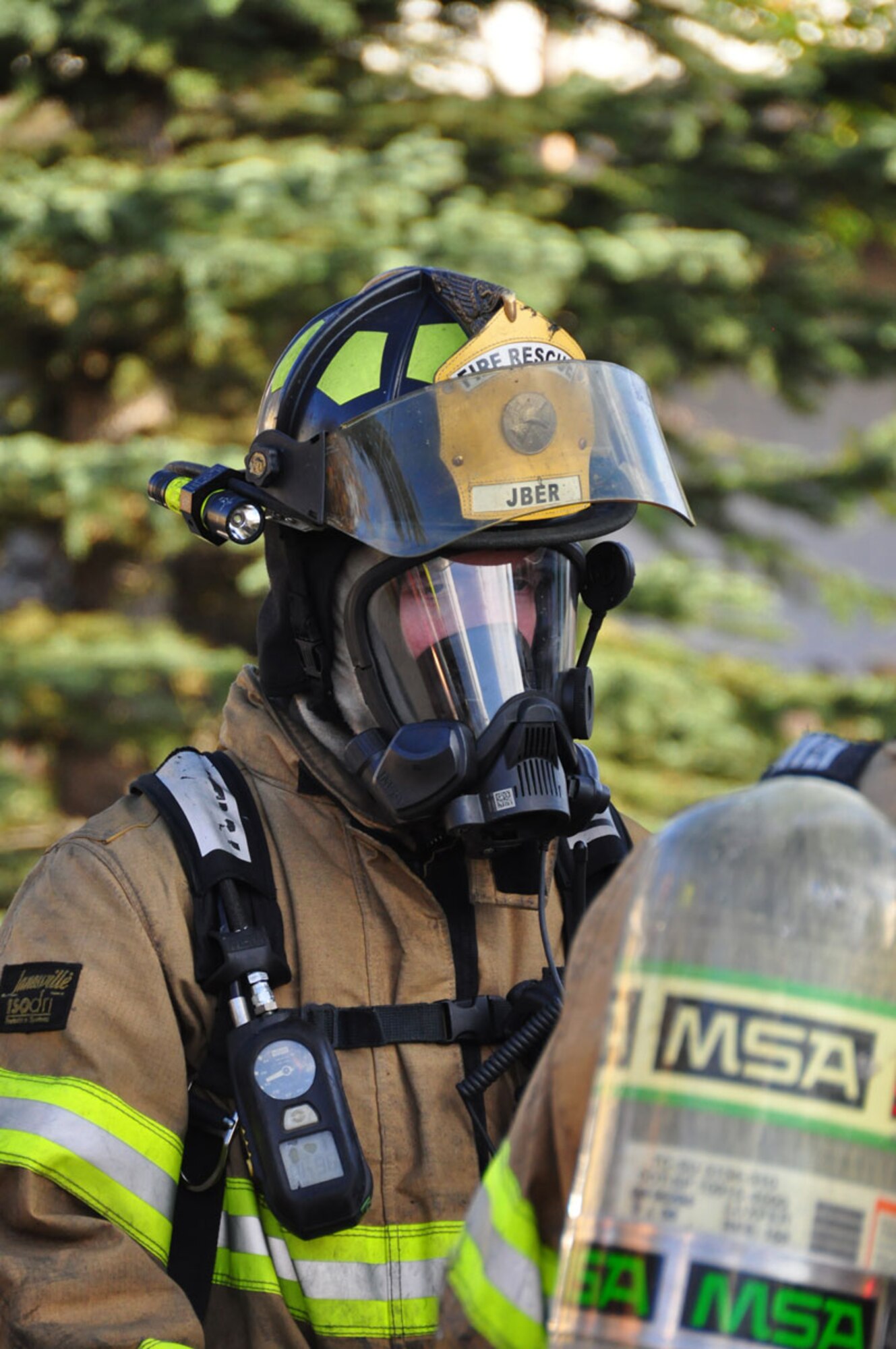 The Joint Base Elmendorf-Richardson Firefighters respond to a fire in base housing, Alaska, Sept. 28, 2011. Twenty-nine firefighters fought the blazes for more than four hours.  (U.S. Air Force photo by Maj. Joseph Coslett)