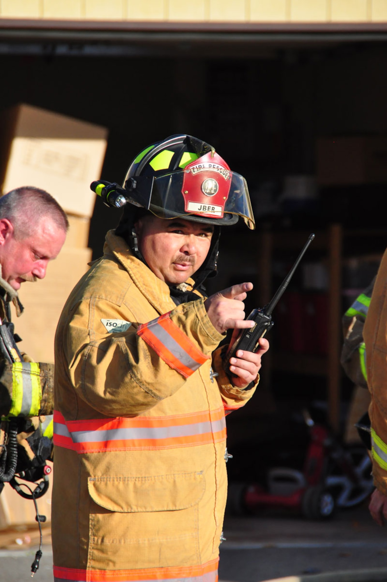 The Joint Base Elmendorf-Richardson Firefighters respond to a fire in base housing, Alaska, Sept. 28, 2011. Twenty-nine firefighters fought the blazes for more than four hours.  (U.S. Air Force photo by Maj. Joseph Coslett)