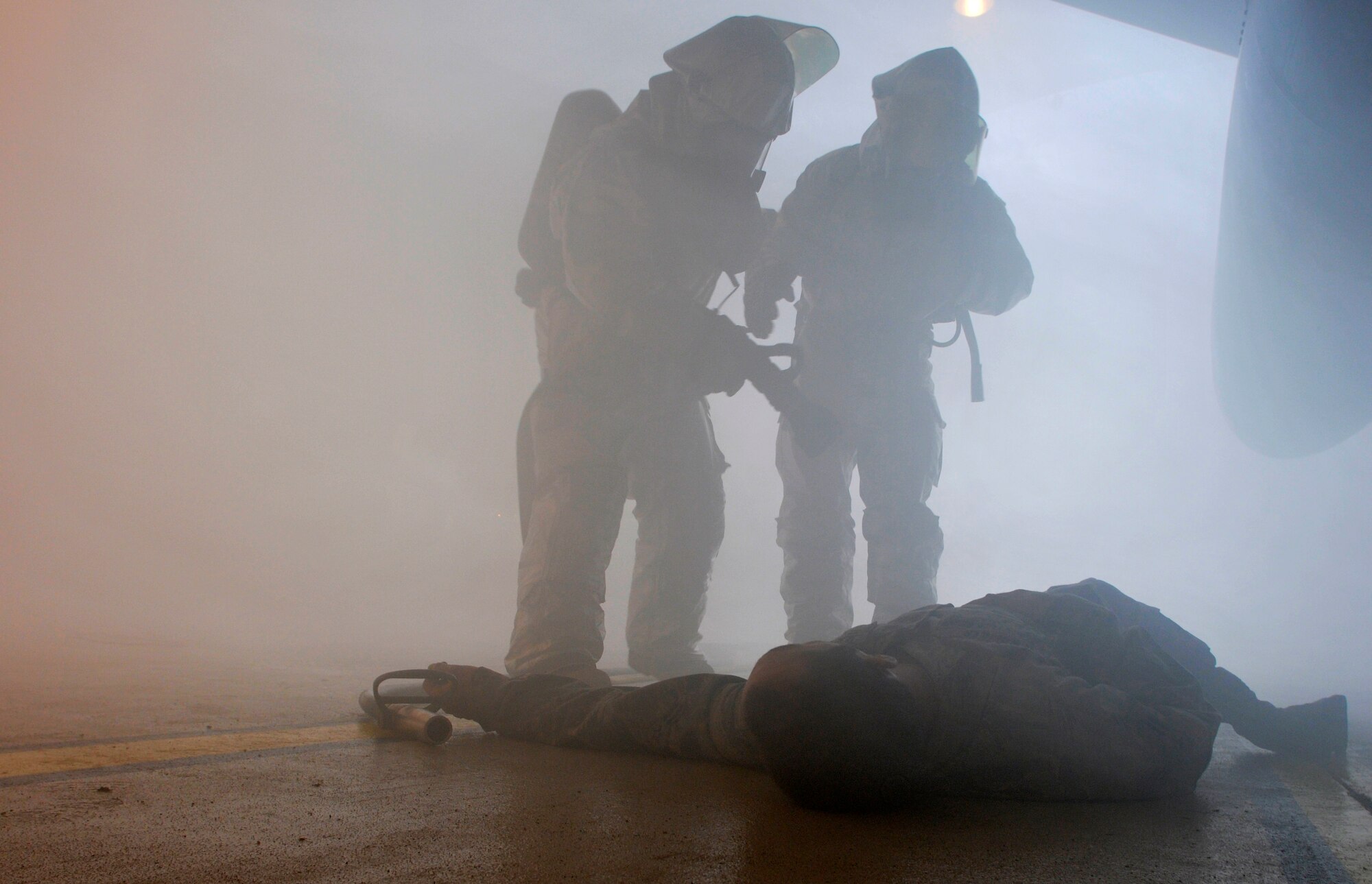 ROYAL AIR FORCE LAKENHEATH, England - Firefighters from the 48th Civil Engineer Squadron rescue Airman 1st Class Michael Koehler, 48th Aircraft Maintenance Squadron weapons load crew member, during an exercise, Sept. 27, 2011. The 48th CES firefighters train routinely to remain proficient and ready to respond to emergencies. (U.S. Air Force photo by Senior Airman Tiffany M. Deuel)