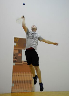 Airman 1st Class Sean Minnis, 2nd Aircraft Maintenance Squadron crew chief, jumps to hit the ball while playing racquetball at the Barksdale Fitness Center Sept. 28 on Barksdale Air Force Base, La. Minnis is a new Airman and recently completed his First Term Airman Center training. (U.S. Air Force photo/Airman 1st Class Andrea F. Liechti)(RELEASED)