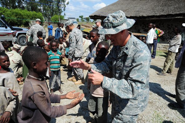 72nd Air Base Wing Chaplain (Lt.?Col.) David Terrinoni plays with children at an Ethiopian orphanage for HIV positive girls during his deployment as a chaplain with the Combined Joint Task Force- Horn Of Africa. (Courtesy photo)
