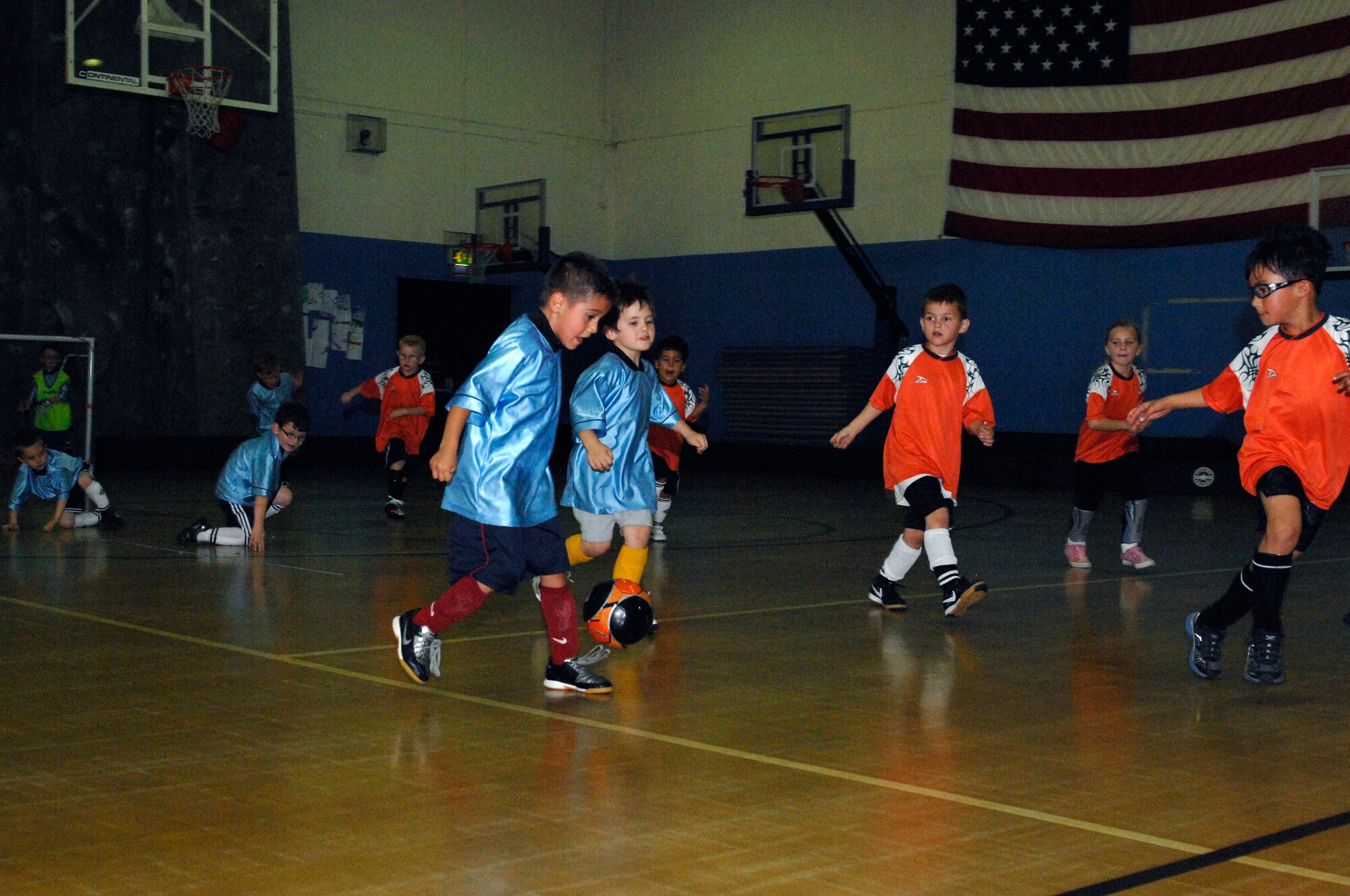ROYAL AIR FORCE LAKENHEATH, England - Members from the 'Flames' and 'Bulldogs' scramble for the ball during a youth soccer league game Sept. 27, 2011.  The game featured youth from both RAFs Mildenhall and Lakenheath's youth sports program and ended in a 3-3 tie. The indoor soccer league runs from Sept. 20 to Nov. 11 and is open to all ages.  For more information call 226-3180.  (U.S. Air Force photo by Tech. Sgt. Lee A. Osberry Jr.)