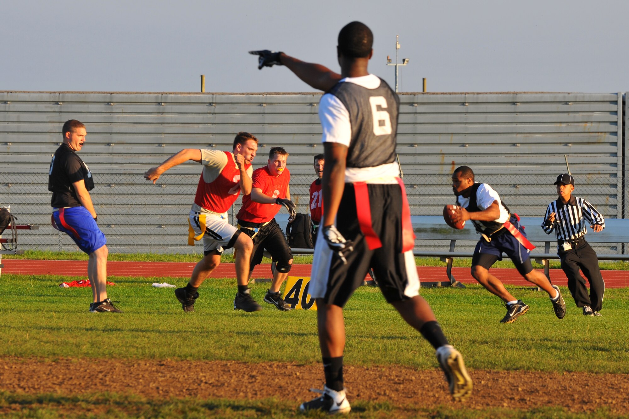 SPANGDAHLEM AIR BASE, Germany – Moses McNeal, 52nd Equipment Maintenance Squadron, carries the ball for a gain against the 52nd Operations Group during an intramural flag football game here Sept. 28. The 52nd EMS beat the 52nd OG 6-0. (U.S. Air Force photo/Airman 1st Class Dillon Davis)