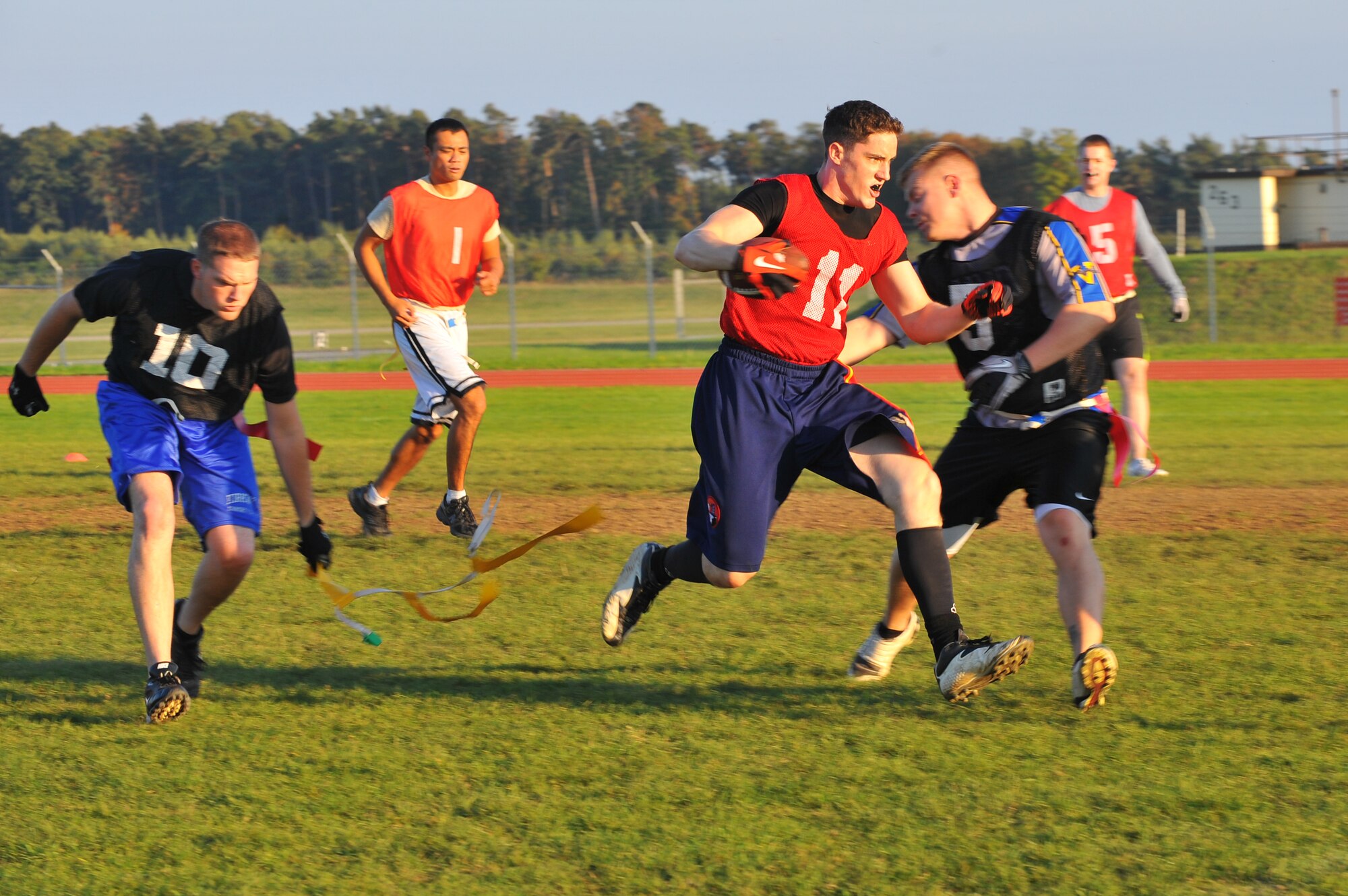 SPANGDAHLEM AIR BASE, Germany – Timothy Scott, 52nd Operations Group, carries the ball for a first down against the 52nd Equipment Maintenance Squadron during an intramural flag football game here Sept. 28. The 52nd EMS beat the 52nd OG 6-0. (U.S. Air Force photo/Airman 1st Class Dillon Davis)