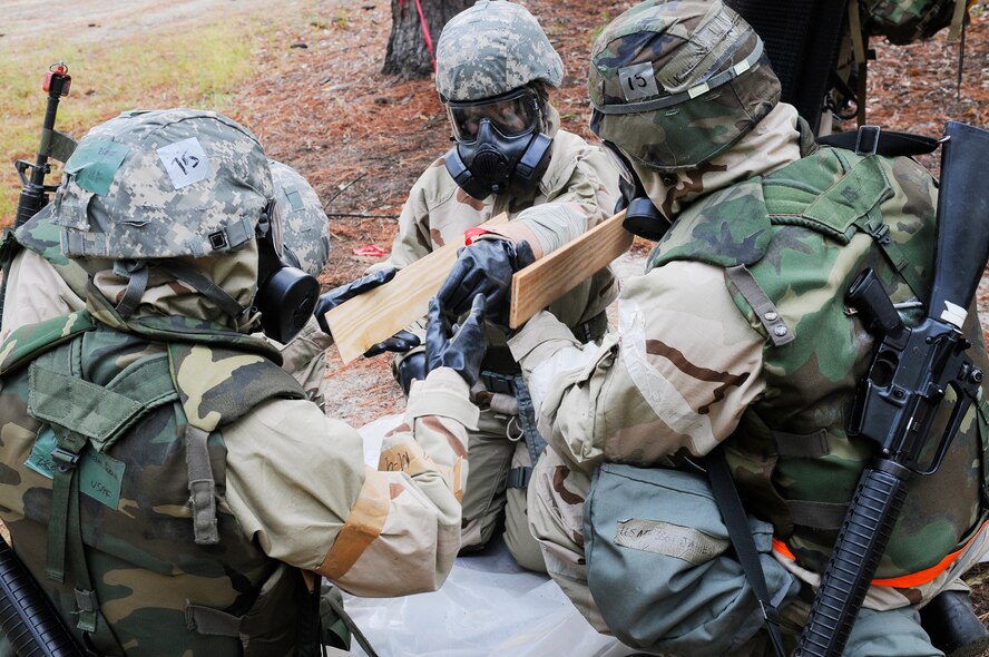 Airmen administer self-help buddy care during exercises Sept 21 at Warrior Air Base. U. S. Air Force photo by Sue Sapp