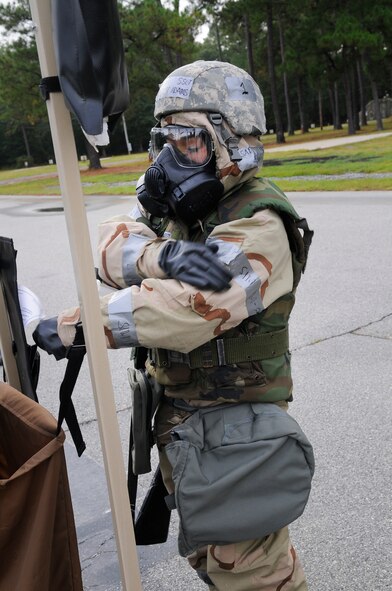 An Airman goes through the motions of the de-contamination process during exercise training. U. S. Air Force photo by Sue Sapp