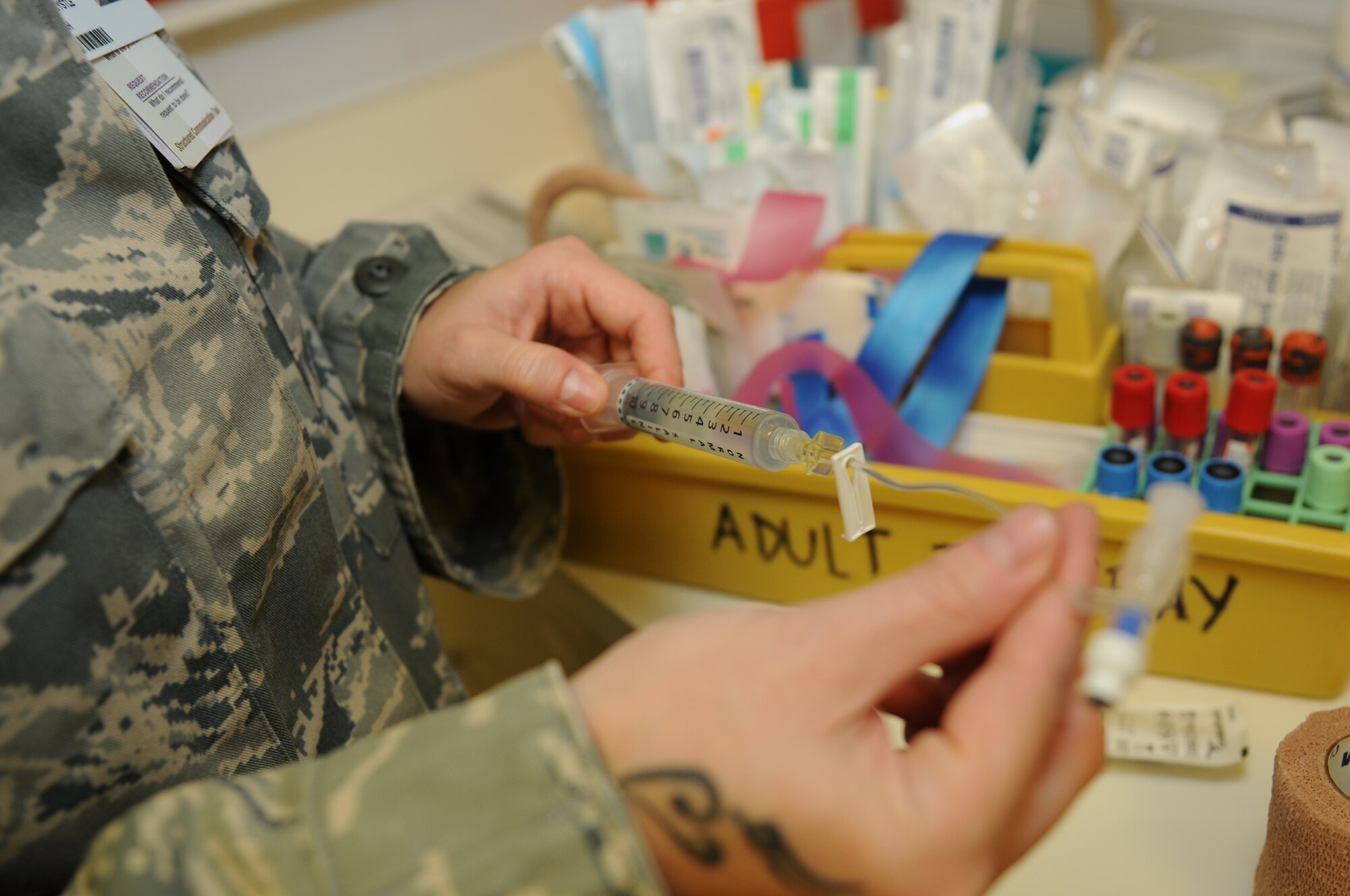 ROYAL AIR FORCE LAKENHEATH, England - Senior Airman Krystle Clark, 48th Inpatient Care Squadron Multi-Service Unit medical technician, prepares an IV on Sept 26, 2011.  The MSU cares for approximately 280 inpatients and 20 specialty care patients per year. (U.S. Air Force photo by Airman Cory D. Payne)
