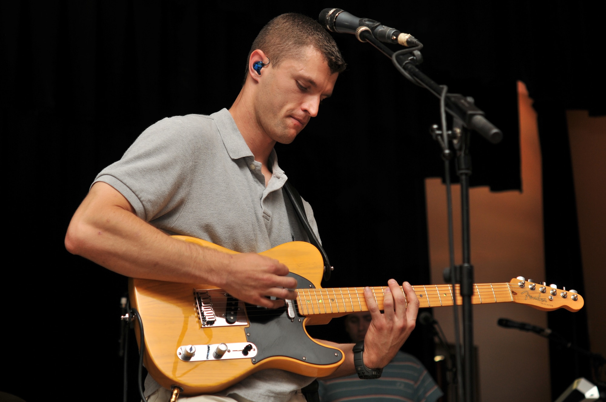 BLOEMFONTAIN, South Africa - Staff Sgt. Dustin Trimble, U.S. Air Forces in Europe Band “Touch ‘n Go” lead guitarist, performs Sept. 28 at Navalsig High School. The band performed at several locations in South Africa as part of their support of the Waterkloof Air Show. (U.S. Air Force photo by Staff Sgt. David Dobrydney)