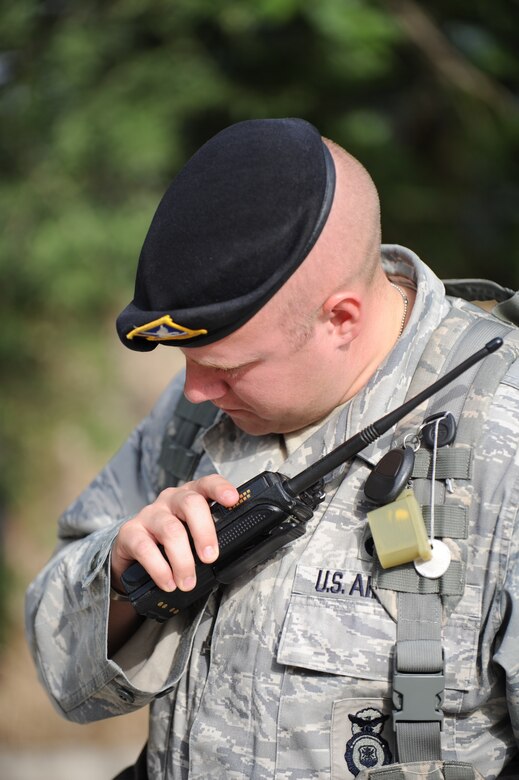 Staff Sgt. Christopher Allen, 39th Security Forces Squadron, listens to radio traffic while performing a walk-around of a building Sept. 29, 2011, at Incirlik Air Base, Turkey.  Allen works alongside members of the Turkish air force while on patrols. (U.S. Air Force photo by Senior Airman Clayton Lenhardt/Released)