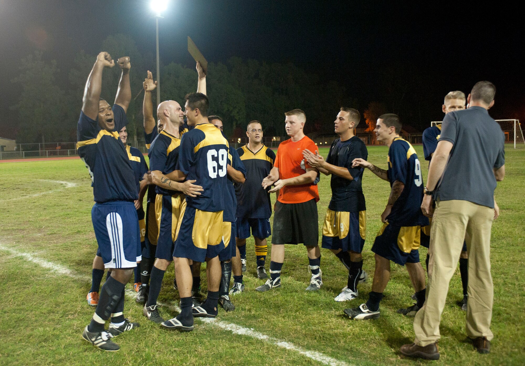 The 728th Air Mobility Squadron celebrates after winning the intramural soccer championship game Sept. 29, 2011, at Incirlik Air Base, Turkey. The 728th AMS won against the 39th Security Forces Squadron 3-1. (U.S. Air Force photo by Senior Airman Clayton Lenhardt/Released)