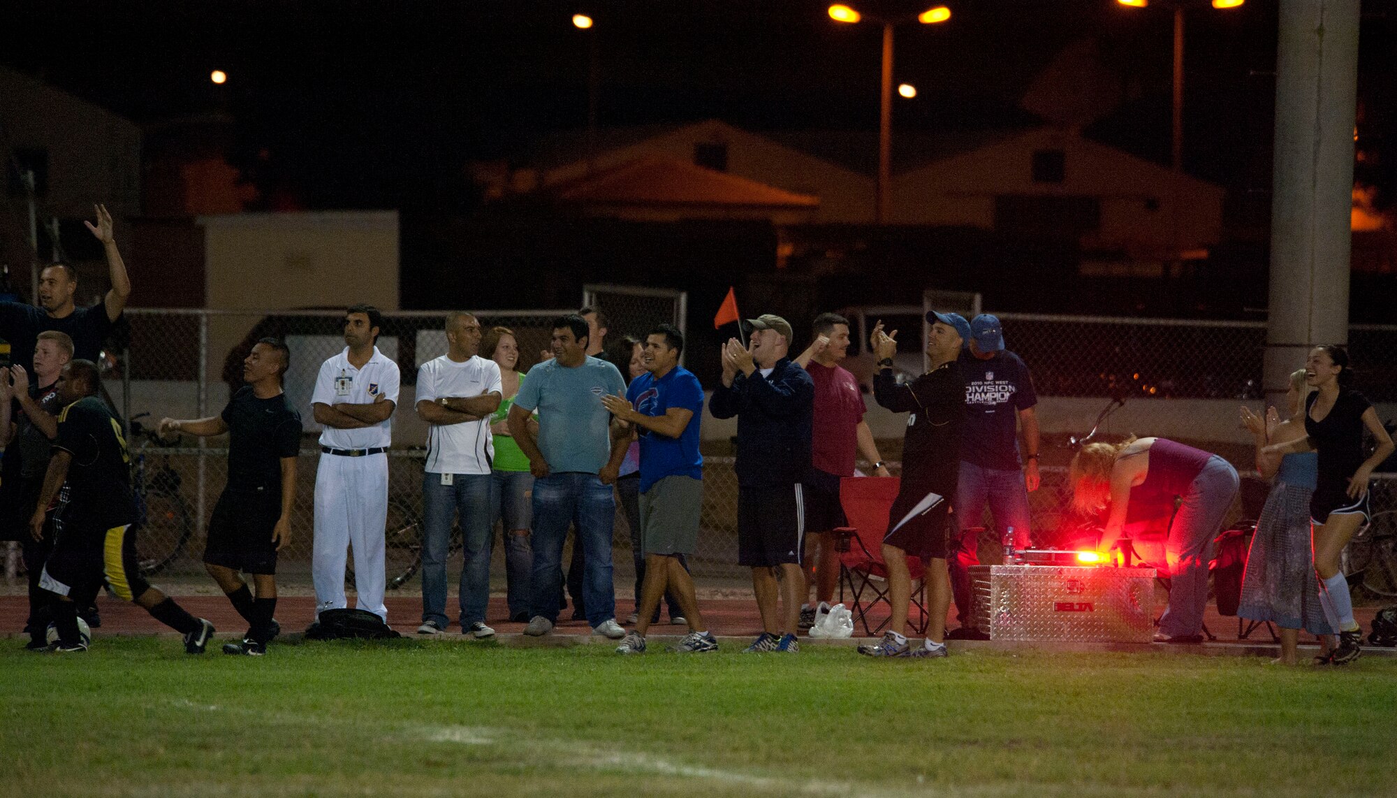 Fans and players for the 39th Security Forces Squadron react to a goal during the intramural soccer championship game Sept. 29, 2011, at Incirlik Air Base, Turkey. The 728th Air Mobility Squadron won against the 39th SFS 3-1. (U.S. Air Force photo by Senior Airman Clayton Lenhardt/Released)