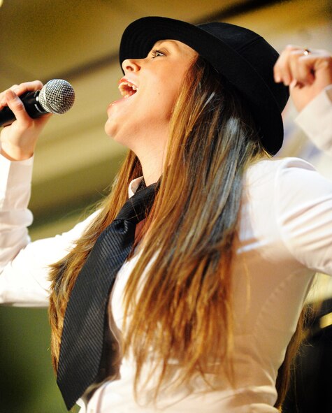 U.S. Air Force Senior Airman Airman Courtney Slater, 20th Medical Support Squadron medical material journeyman, sings "Misery" by Pink during her Shaw Idol performance at Carolina Skies Club, Shaw Air Force Base, S.C., Sept. 28, 2011. . Shaw Idol was a four-week long singing competition in which John Kennedy, 20th Force Support Squadron school liaison officer, took the first place win and Slater took second place. (U.S. Air Force photo by Airman 1st Class Tabatha Duarte/Released)