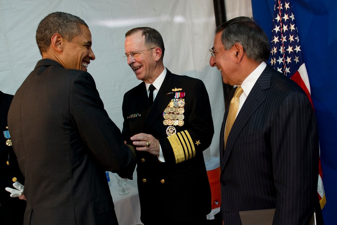 President Barack Obama greets Navy Adm. Mike Mullen, outgoing chairman of the Joint Chiefs of Staff, and Defense Secretary Leon E. Panetta at the Joint Chiefs of Staff change of responsibility ceremony on Joint Base Myer-Henderson Hall, Va., Sept. 30, 2011. Army Gen. Martin E. Dempsey became the 18th chairman of the Joint Chiefs of Staff during the ceremony, succeeding Navy Adm. Mike Mullen who retired after 43 years of military service. 