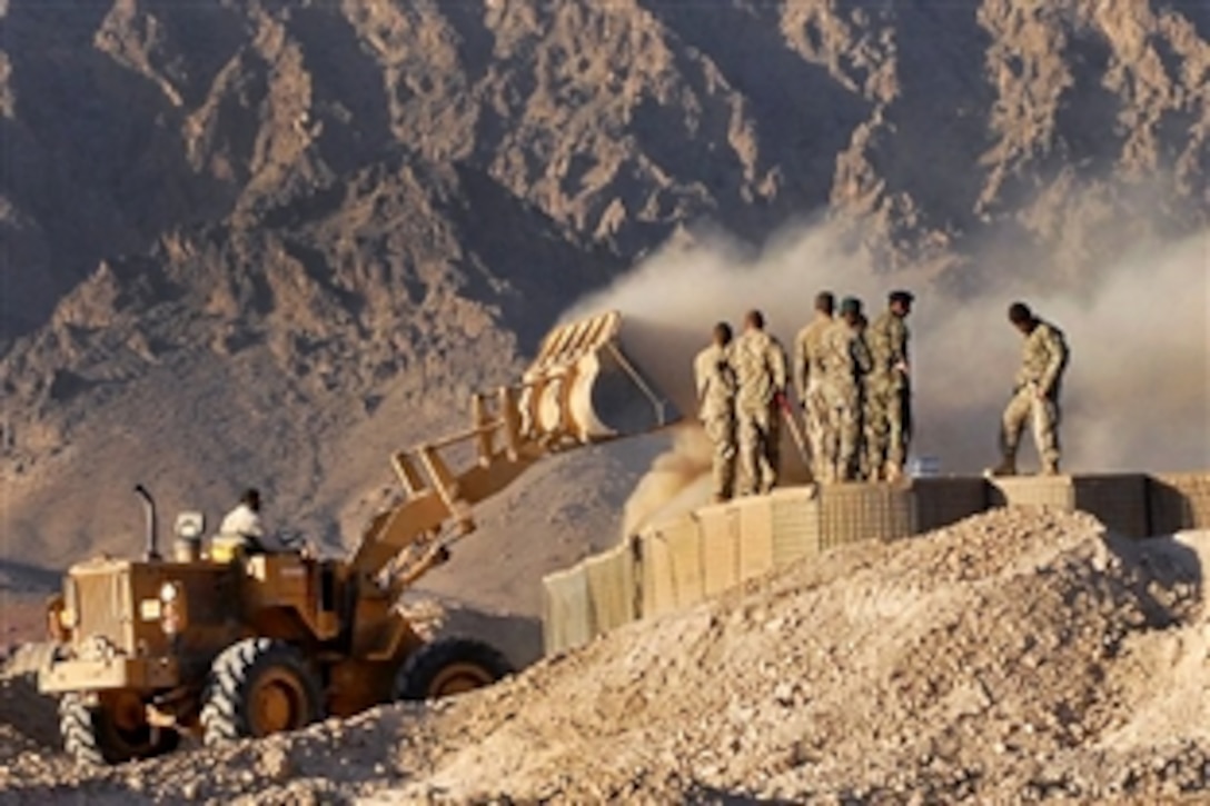 U.S. Army and Afghan soldiers build the perimeter of Checkpoint 4 along Route Chicken as part of Operation Fairbanks in Zabul province, Afghanistan, Sept. 24, 2011. The soldiers are assigned to Company C, 1st Battalion, 24th Infantry Regiment, deployed from Alaska. Operation Fairbanks was a route clearing and stability operation to reclaim a major trade route between Qalat and Mizan that had been held by the Taliban for the past year.