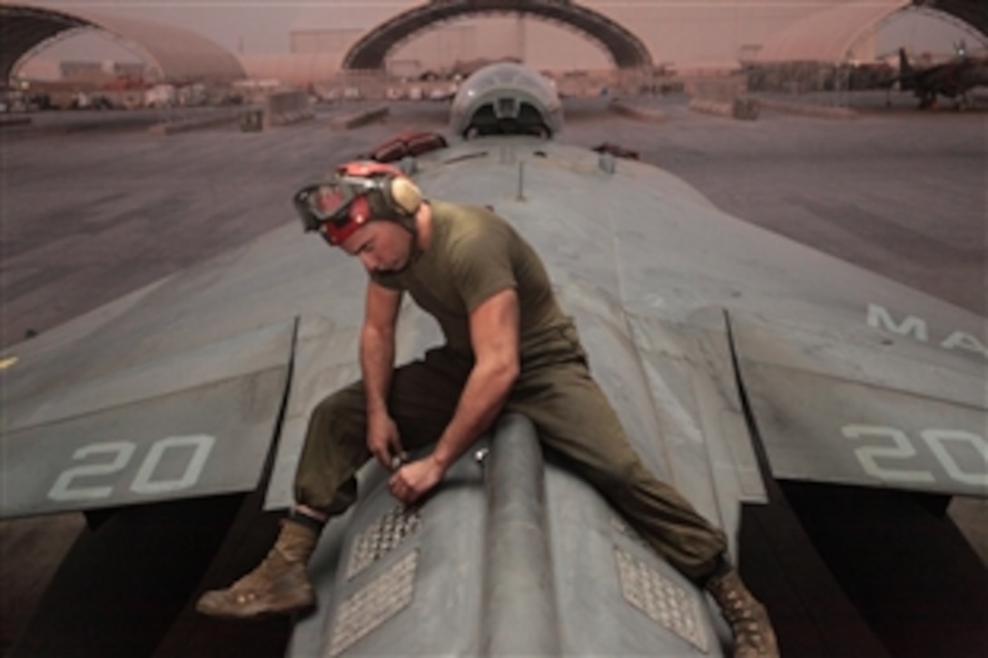 U.S. Marine Corps Cpl. Michael Garetz inspects flares loaded aboard a AV-8B Harrier on the flightline on Kandahar Airfield in Afghanistan, Sept. 29, 2011. Garetz is a Marine attack squadron 513 ordnance technician.

