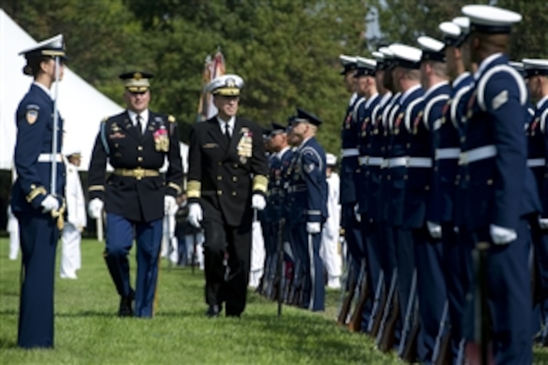 Navy Adm. Mike Mullen, chairman of the Joint Chiefs of Staff, reviews troops during his retirement ceremony and Armed Forces Farewell at Summerall Field on Joint Base Myer-Henderson Hall, Va., Sept. 30, 2011. Army Gen. Martin E. Dempsey will succeed Mullen as the 18th chairman of the Joint Chiefs of Staff. 