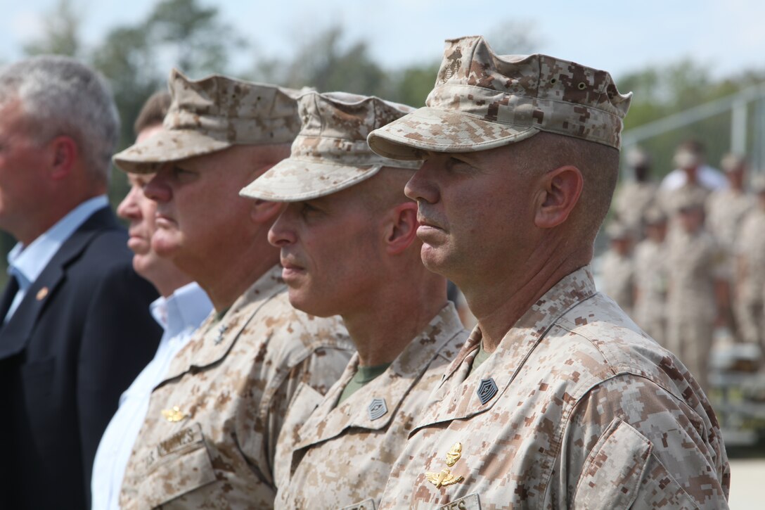 Sgt. Maj. Richard W. Ashton (right), former sergeant major of U.S. Marine Corps Forces, Special Operations Command, stands beside oncoming Sgt. Maj. Thomas F. Hall, Maj. Gen. Paul E. Lefebvre, MARSOC commander, and the former sergeants major of MARSOC during a post and relief ceremony aboard Camp Lejeune, N.C. Sept. 30. As Hall prepares to take the reins as MARSOC's top senior-enlisted, Ashton is retiring after 32 years of service.