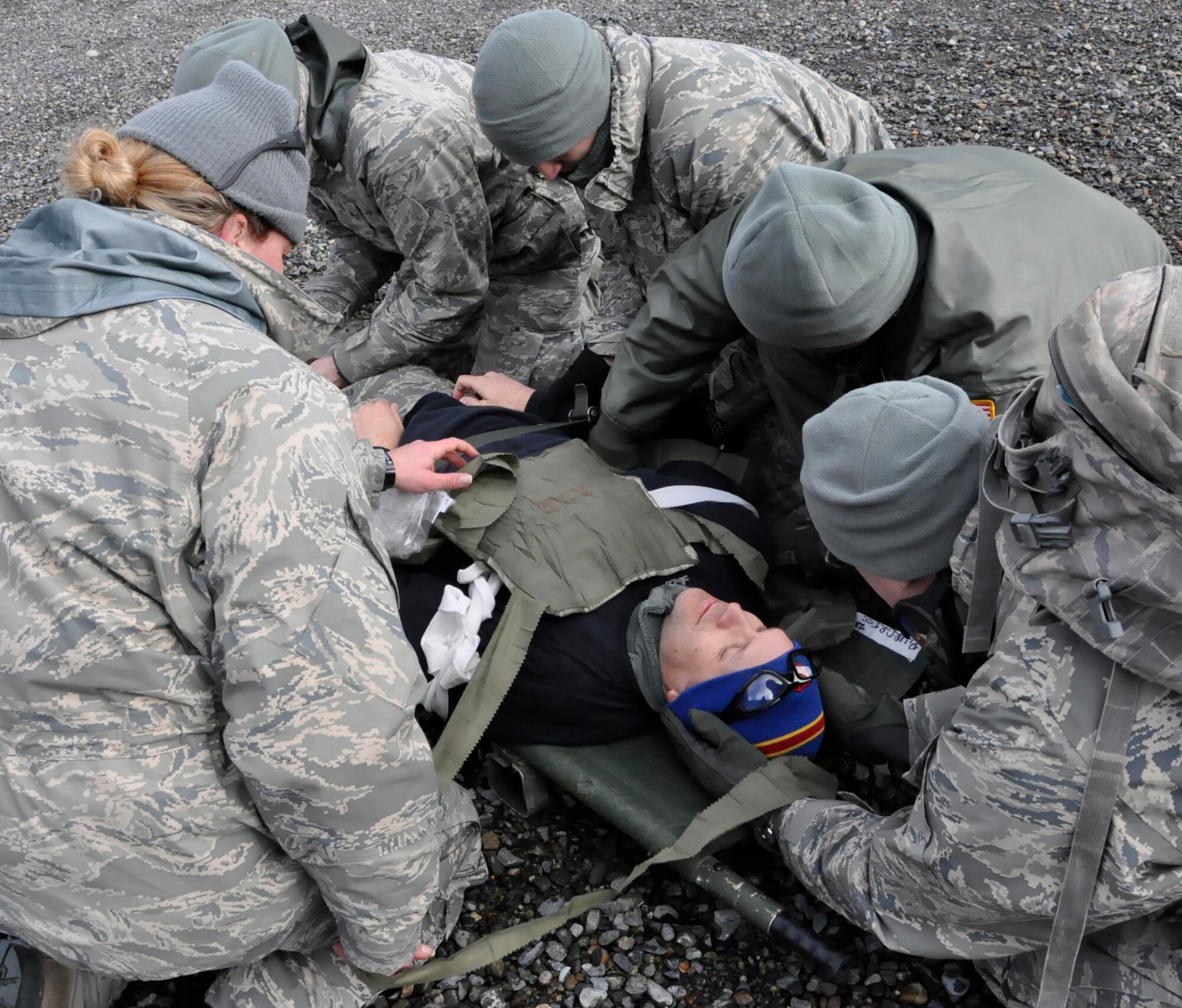 446th AES Reservists treat a simulated patient during an EMT refresher course on Fort Lewis, Wash. on Sunday, April 1st. Their unit is the only one in the Air Force with such a hands-on training curriculum to update their EMT skills.
