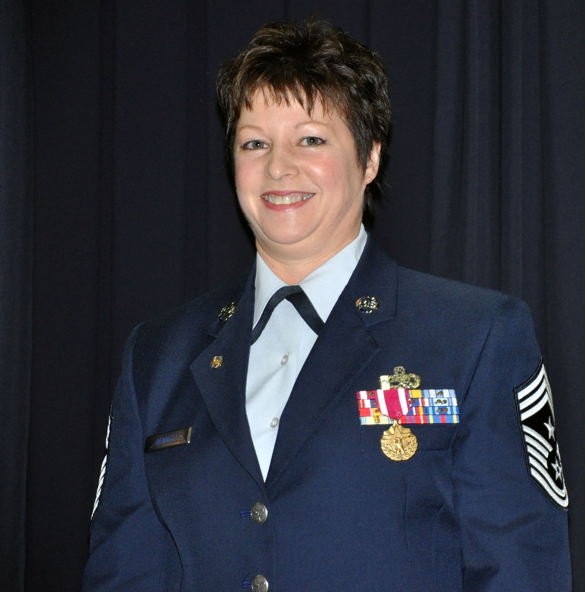 Retired Chief Master Sgt. Gloria Bennett, former command chief of the 446th Airlift Wing, received her retirement honors during a ceremony here, April 1.  Attendees included Chief Master Sgt. Kathleen Buckner, Air Force Reserve Command command chief, current and past commanders, coworkers from Bennett's 33-year career, as well as family and friends.  (U.S. Air Force photo by Tech. Sgt. Elizabeth Moody)