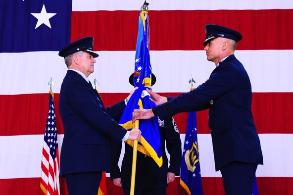 Gen. Mark A. Welsh III, United States Air Forces in Europe commander, gives 3rd Air Force command to Lt. Gen. Craig A. Franklin, 3rd Air Force commander, during a change of command ceremony on Ramstein Air Base, Germany, March 30, 2012. Franklin took command of the 3rd Air Force from Lt. Gen. Frank Gorenc. (U.S. Air Force photo/Airman Brea Miller)