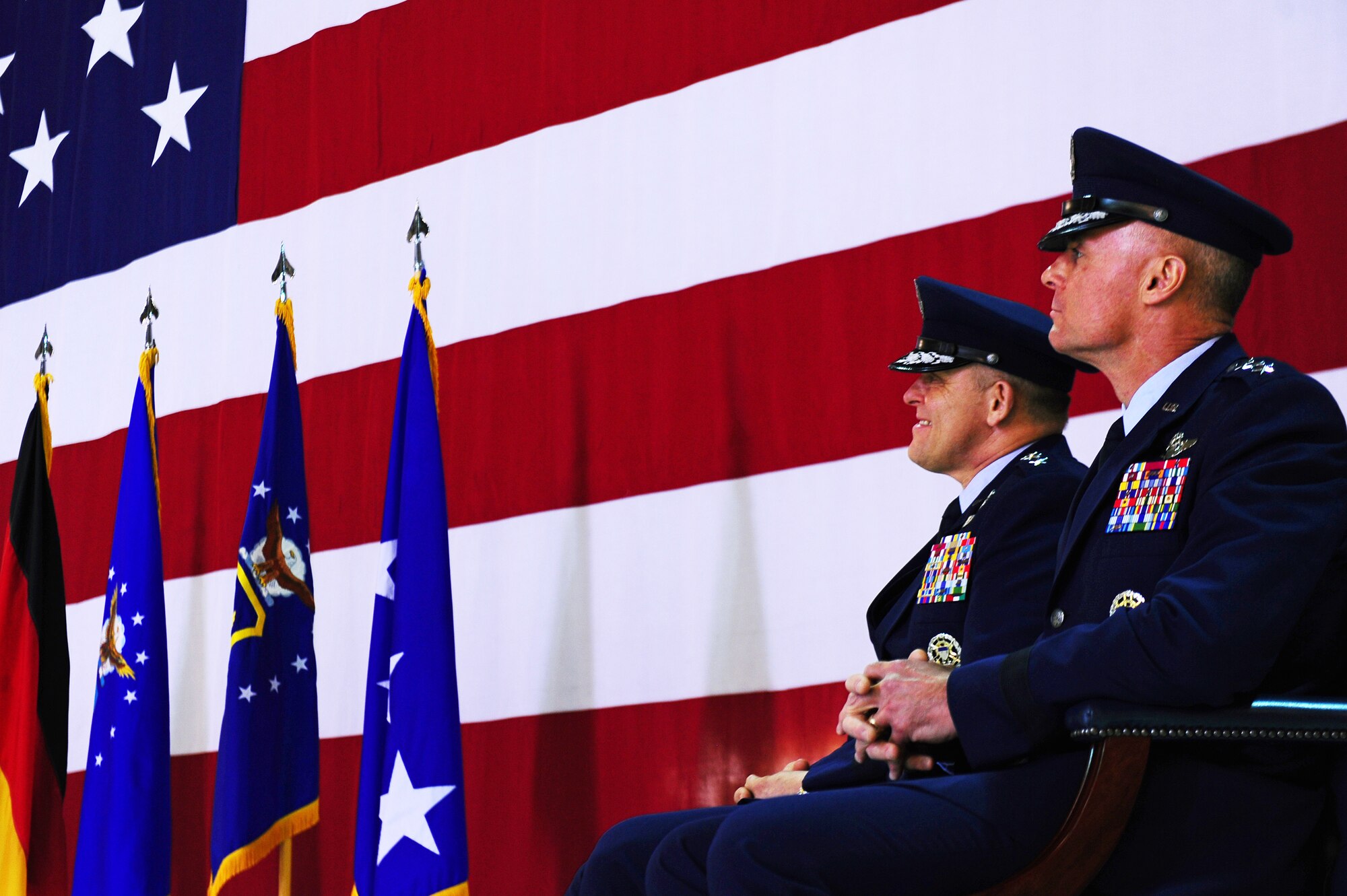 Lt. Gen. Frank Gorenc, outgoing 3rd Air Force commander, and Lt. Gen. Craig Franklin, incoming 3rd Air Force commander, listen to Gen. Mark A. Welsh III, United States Air Forces in Europe commander, during a change of command ceremony on Ramstein Air Base, Germany, March 30, 2012. Gorenc passed command to Franklin. (U.S. Air Force photo/Airman Brea Miller)