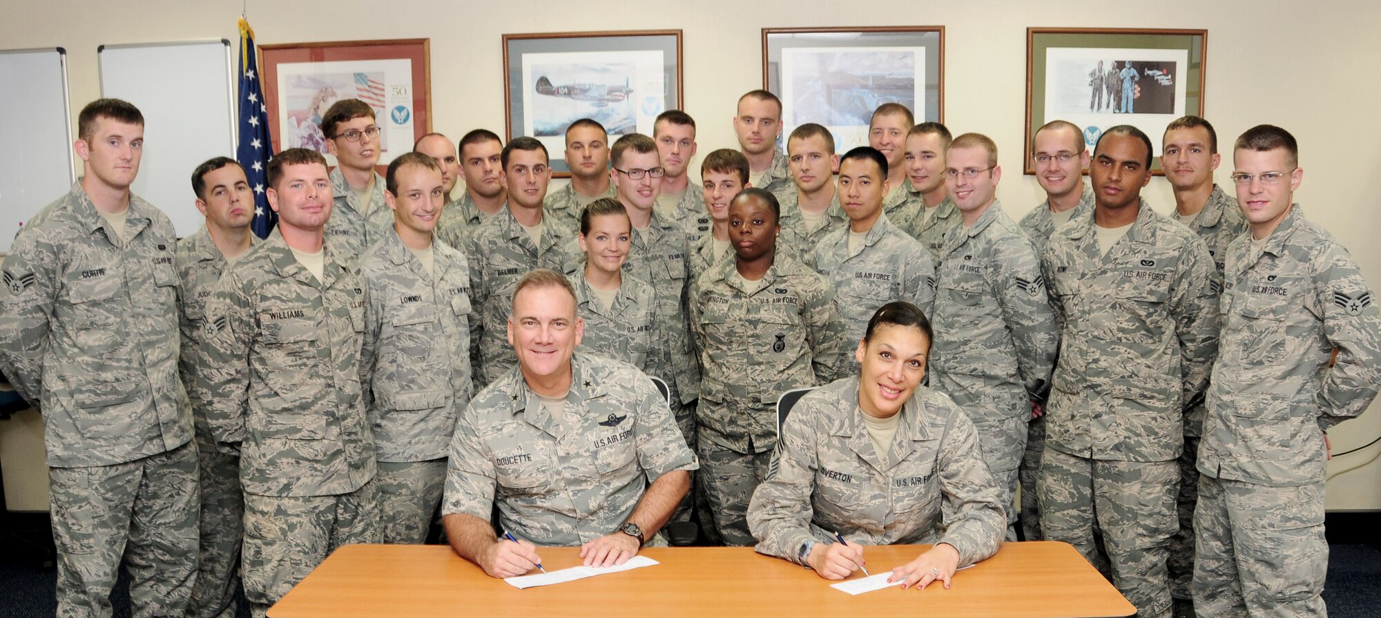 Brig. Gen. John Doucette, 36th Wing commander, and Chief Master Sgt. Margarita Overton, 36th Wing command chief, make their Air Force Assistance Fund donation with the attendance of Airman Leadership Class 12-C March 28 here. The yearly fund raiser offers Airmen the opportunity to contribute to any of the four official Air Force charitable organizations. This year's AFAF will run through May 4. 

AFAF provides an amazing amount of support to Andersen AFB through the Air Force Aid Society This year's motto is "For the Airmen by the Airmen".  Please consider contributing back to AFAS, or one of the other three organizations.

The Air Force Aid Society, which provides Airmen and their families worldwide with emergency financial assistance, education assistance and an array of base-level community-enhancement programs. More information is available at http://www.afas.org/.

 The Air Force Enlisted Village, which includes Teresa Village in Fort Walton Beach, Fla., and Bob Hope Village in Shalimar, Fla., near Eglin Air Force Base. The fund provides homes and financial assistance to widows and widowers of retired enlisted people 55 and older. Hawthorn House, also in Shalimar, provides assisted living for residents requiring more assistance than others, including 24-hour nursing care. More information is available at www.afenlistedwidows.org.

 Air Force Village, which includes Air Force Village I and II in San Antonio, is a life-care community for retired officers, spouses, widows or widowers and family members. The Air Force Village Web site is www.airforcevillages.com. 

 The General and Mrs. Curtis E. LeMay Foundation provides rent and financial assistance to widows and widowers of officer and enlisted retirees in their homes and communities through financial grants of assistance. The LeMay Foundation Web site is www.lemay-foundation.org.

To find the unit point of contact or for more information, contact Staff Sgt. Jermaine Smith or 2nd Lt. Harrison Payne a