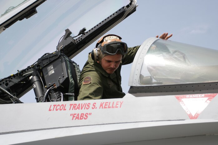 Lance Cpl. Tanner W. Graves, Marine Fighter Attack Squadron 232 fixed-wing aircraft mechanic, checks the inside of an F-18 cockpit here, April 2. Routine checks must be performed to make sure safeties are engaged and there are no problems with the instruments or any components inside of the aircraft.