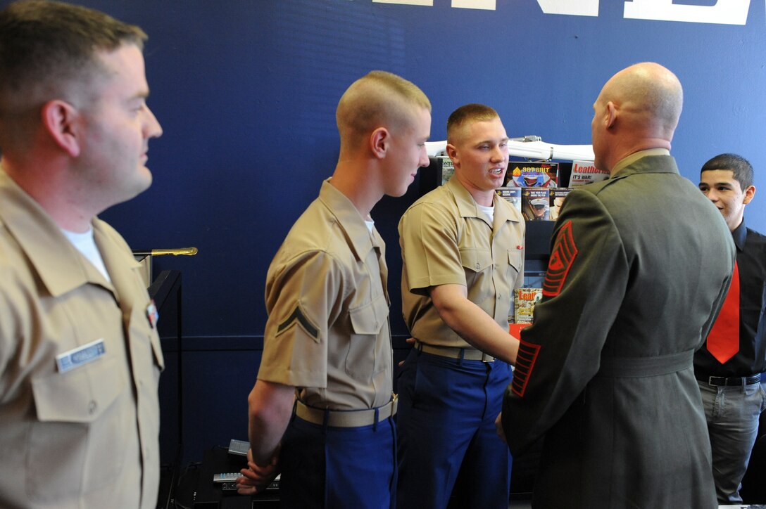 Cpl. Griffin W. Sutherland, rifleman, Fox Company, 2nd Battalion, 3rd Marine Regiment, says goodbye to his daughter before his deployment to Darwin, Australia, April 2. The Marines and Sailors will work closely with their Australian allies on world-class ranges to increase their training capabilities.