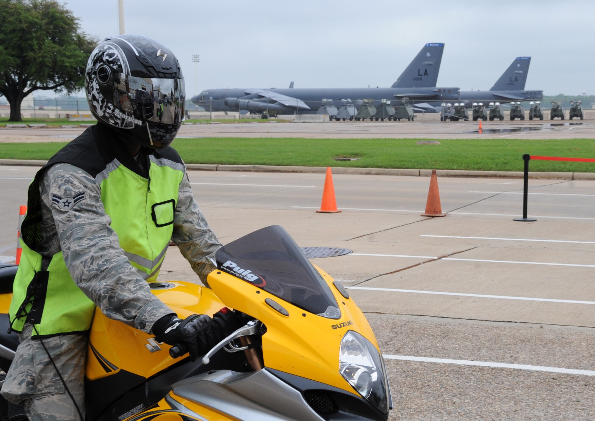Airman 1st Class Cameron Curry, 2nd Logistics Readiness Squadron, arrives at the 2nd Maintenance Squadron Accessories flight hangar for Thunder on the Bayou on Barksdale Air Force Base, La., March 30. After the 50-mile ride, more than 30 enthusiasts met up at the 2nd Maintenance Squadron Accessories flight hangar for raffles, food, games and a bike show. (U.S. Air Force photo/Airman 1st Class Micaiah Anthony)(RELEASED)