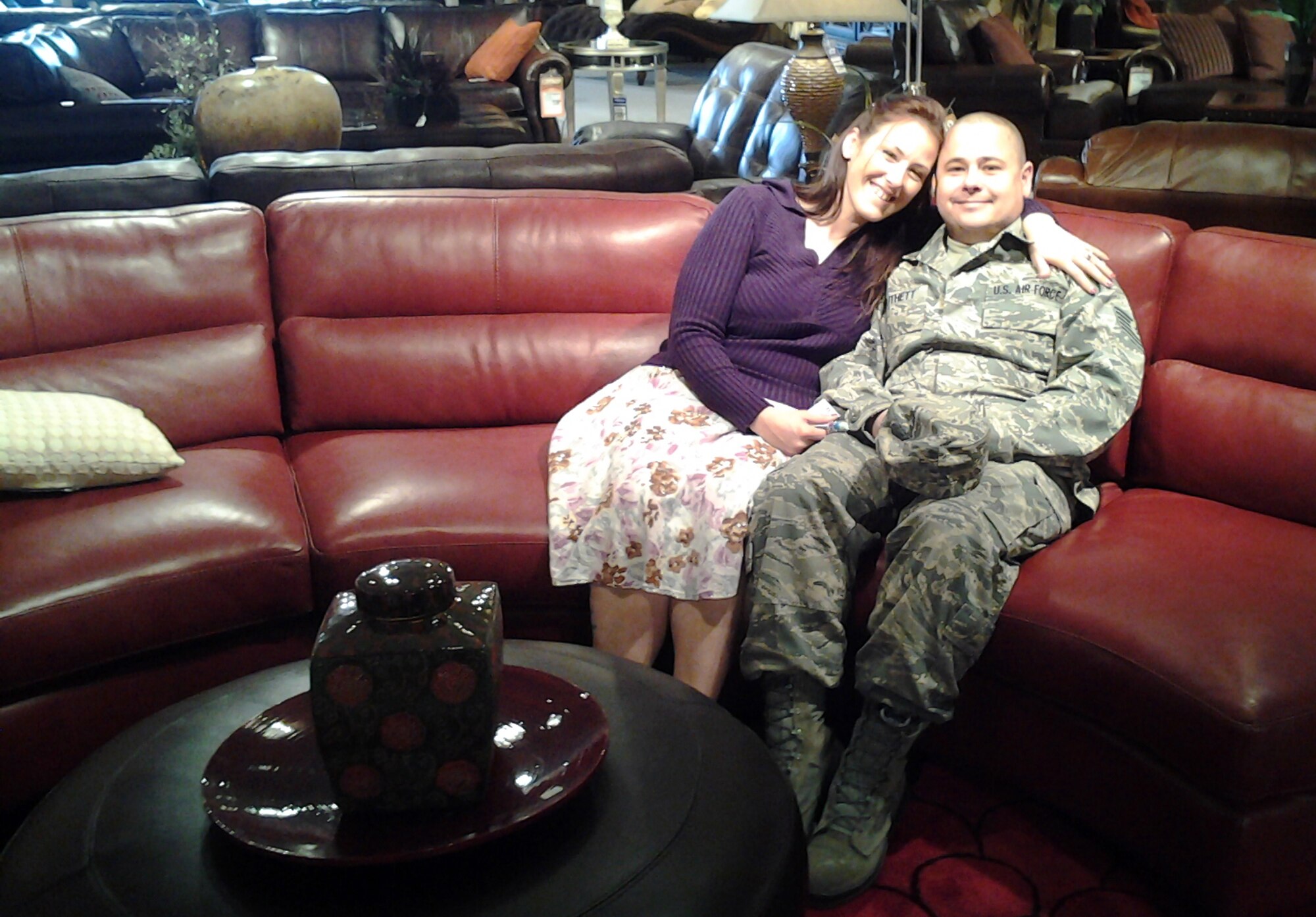 U.S. Air Force Tech. Sgt. DuWayne Douthett and his wife Wendy shop for furniture after the Falcons, community leaders who once served as 388th Fighter Wing honorary commanders, provided a donation of nearly $1,500 to assist the family with buying new furniture.  In January, the couple learned their home was contaminated with methamphetamine and ended up losing nearly everything. (U.S. Air Force courtesy photo/Released)